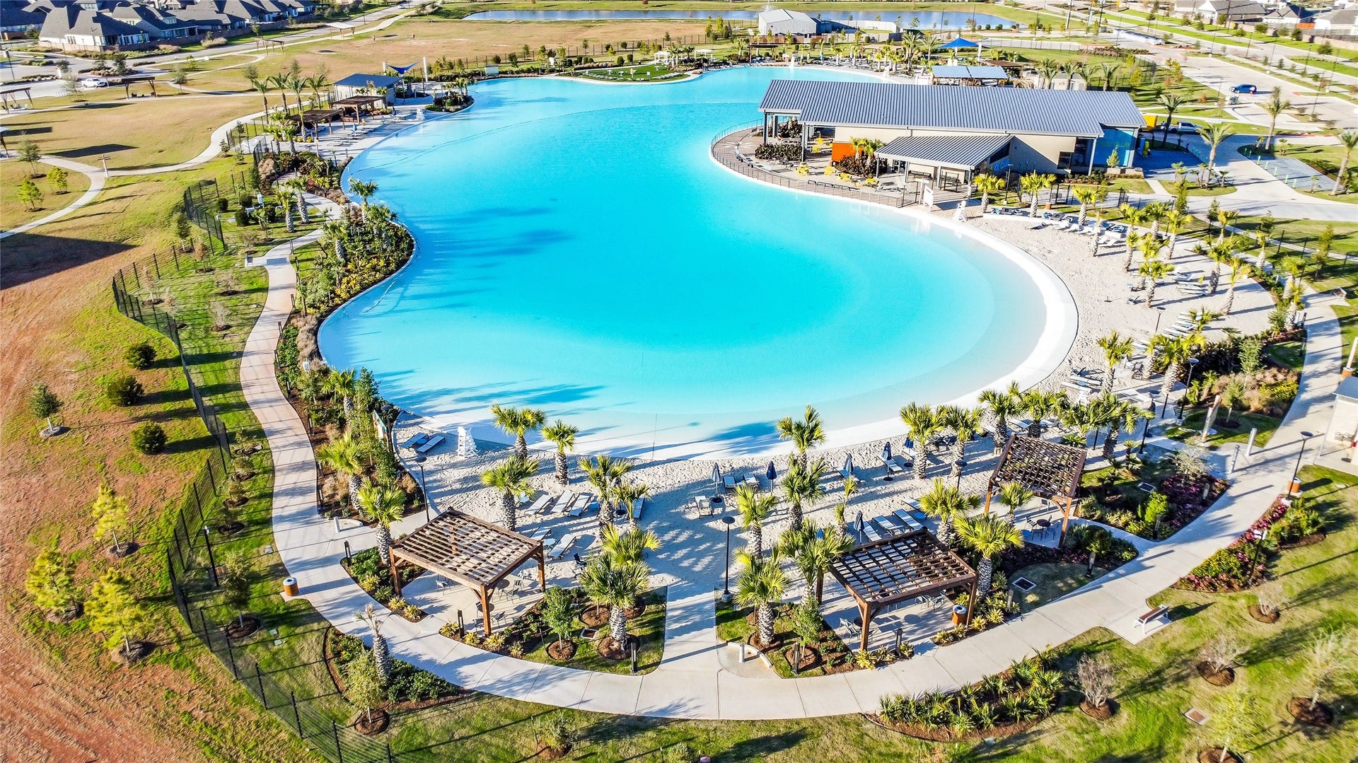 The star feature of The Sol Club
is a Crystal Lagoons amenity
where people can walk along
white-sand beaches, swim,
kayak and paddleboard on
turquoise blue waters  its a
tropical vacation that can be
yours when you live in Sunterra!