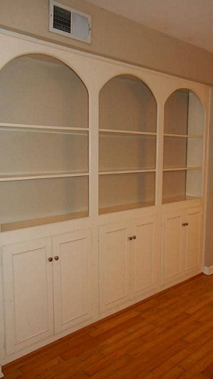 Nice built-ins in the dining/living room area.Engineered wood floors.