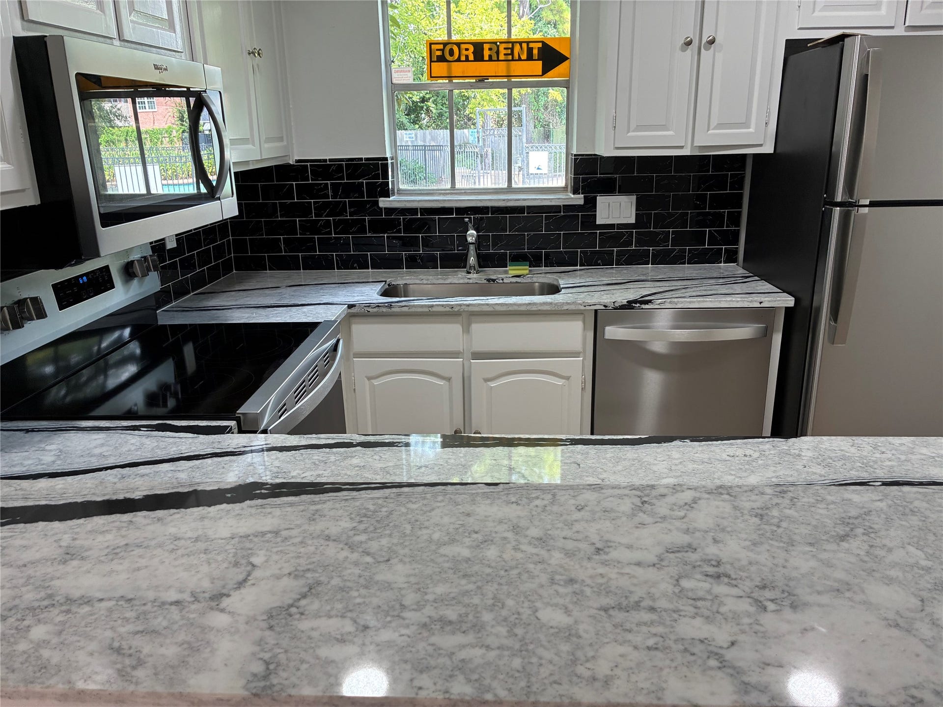 Another view of kitchen from breakfast bar.