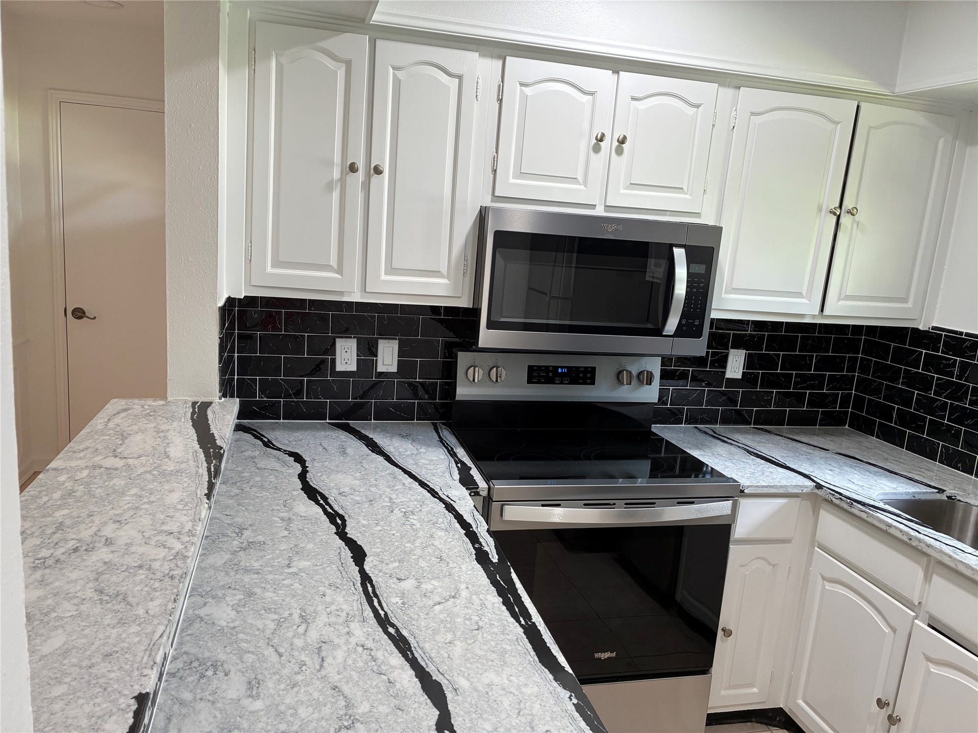 Newly update kitchen; new counters, backsplash and appliances.