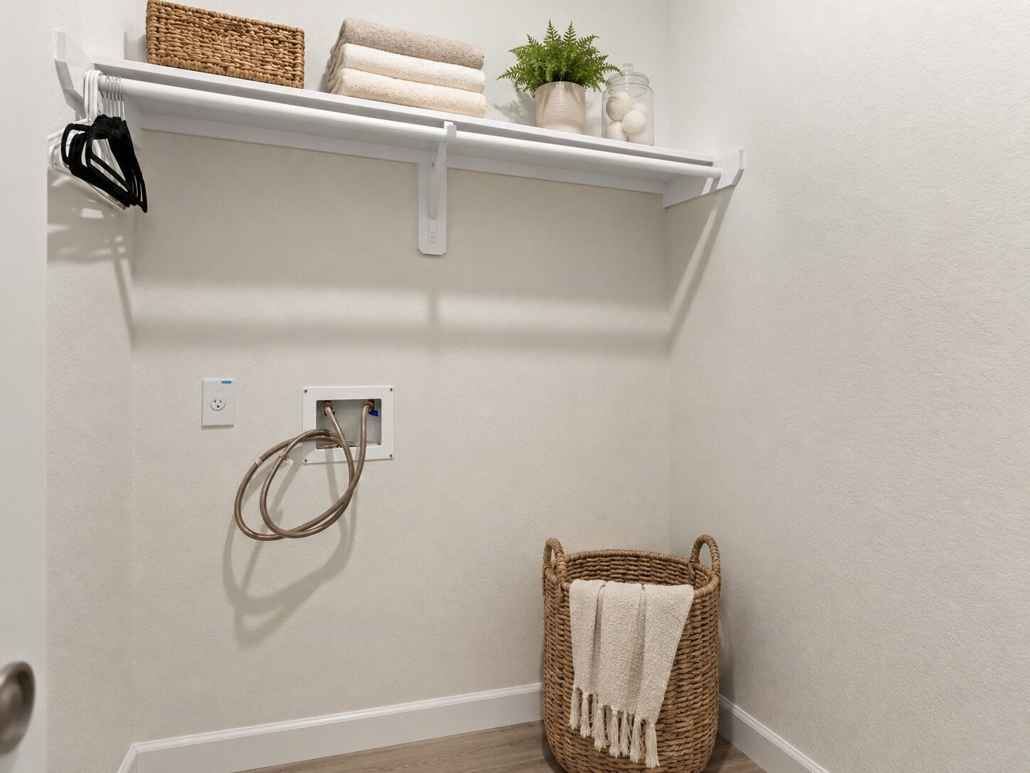 1503 Barras Street, Alvin, TX 77511 *virtually staged* The dedicated laundry room includes built in shelving for household supplies and additional storage.
