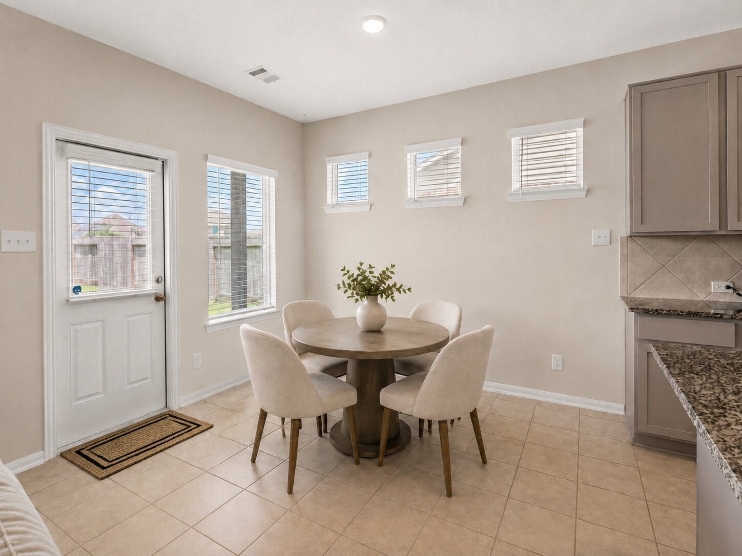1503 Barras Street, Alvin, TX 77511 *virtually staged* The breakfast area provides a comfortable spot for everyday meals with views of the backyard.