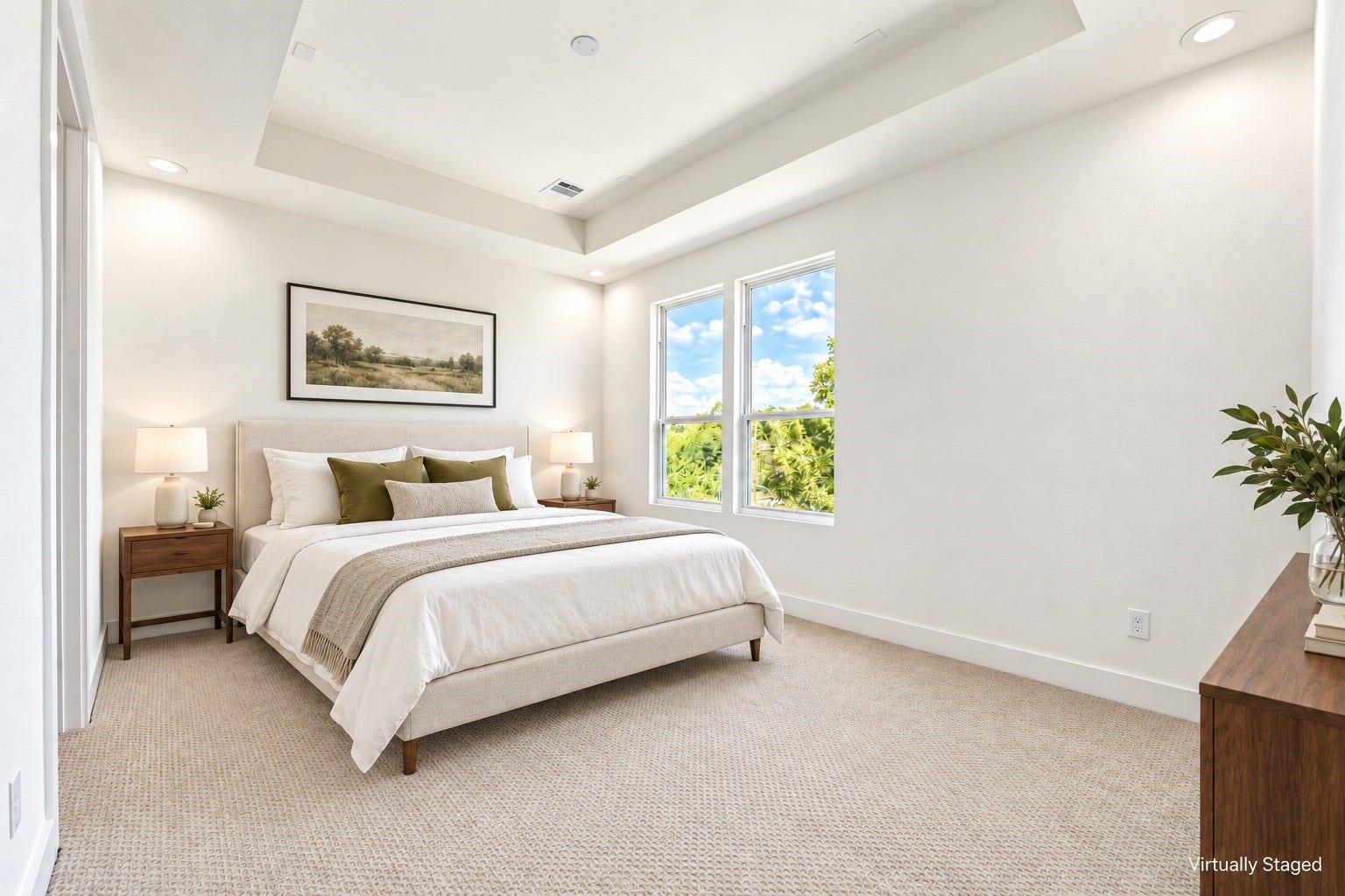 Bright and airy primary suite featuring an elegant tray ceiling, neutral palette, and large windows. *Virtually staged