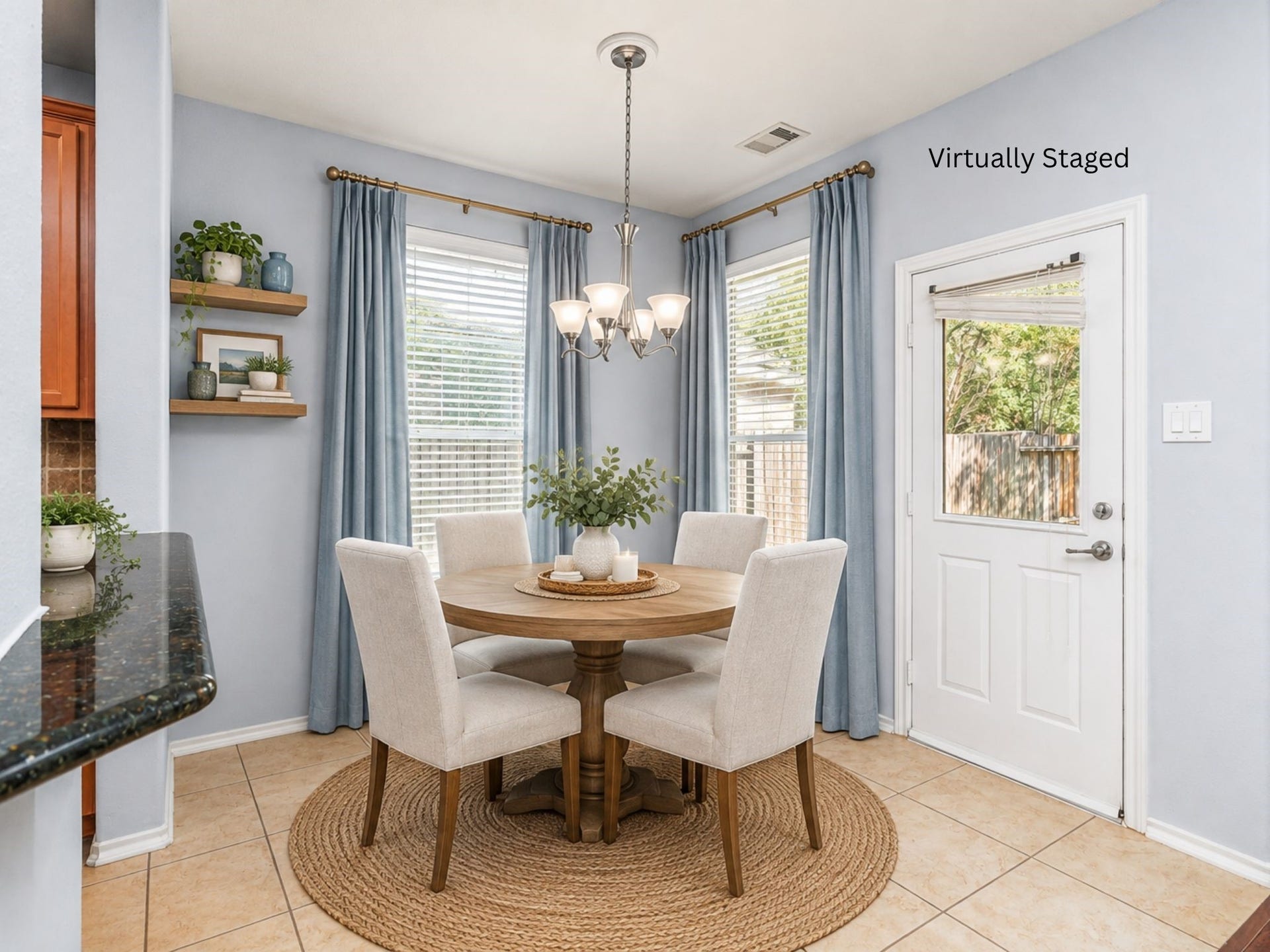 24519 Evangeline Springs Lane, Katy, TX 77494 Virtually staged breakfast area featuring large windows and a nearby exterior door that brings in natural light. The defined dining space offers a comfortable spot for everyday meals with convenient access to the backyard.