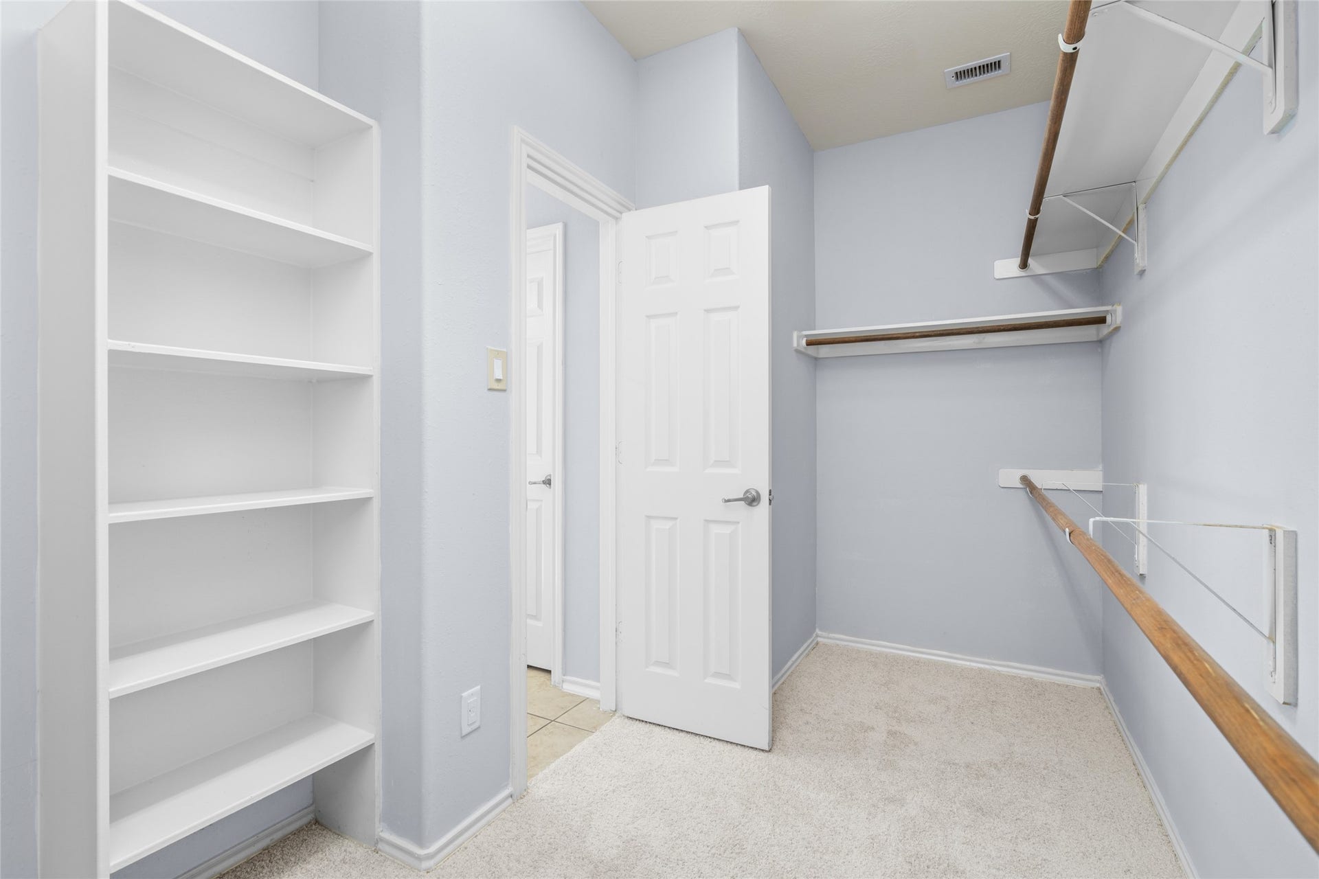 24519 Evangeline Springs Lane, Katy, TX 77494 Walk-in closet with built-in shelving, hanging space, and a practical layout for organizing clothing, shoes, and accessories. The dedicated storage area helps keep the primary bedroom uncluttered and everyday essentials within reach.