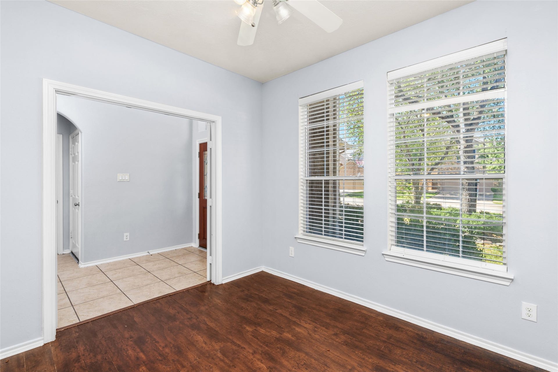 24519 Evangeline Springs Lane, Katy, TX 77494 Bright and inviting, the home office seamlessly connects to the hallway and front door, offering a perfect blend of productivity and welcoming charm.