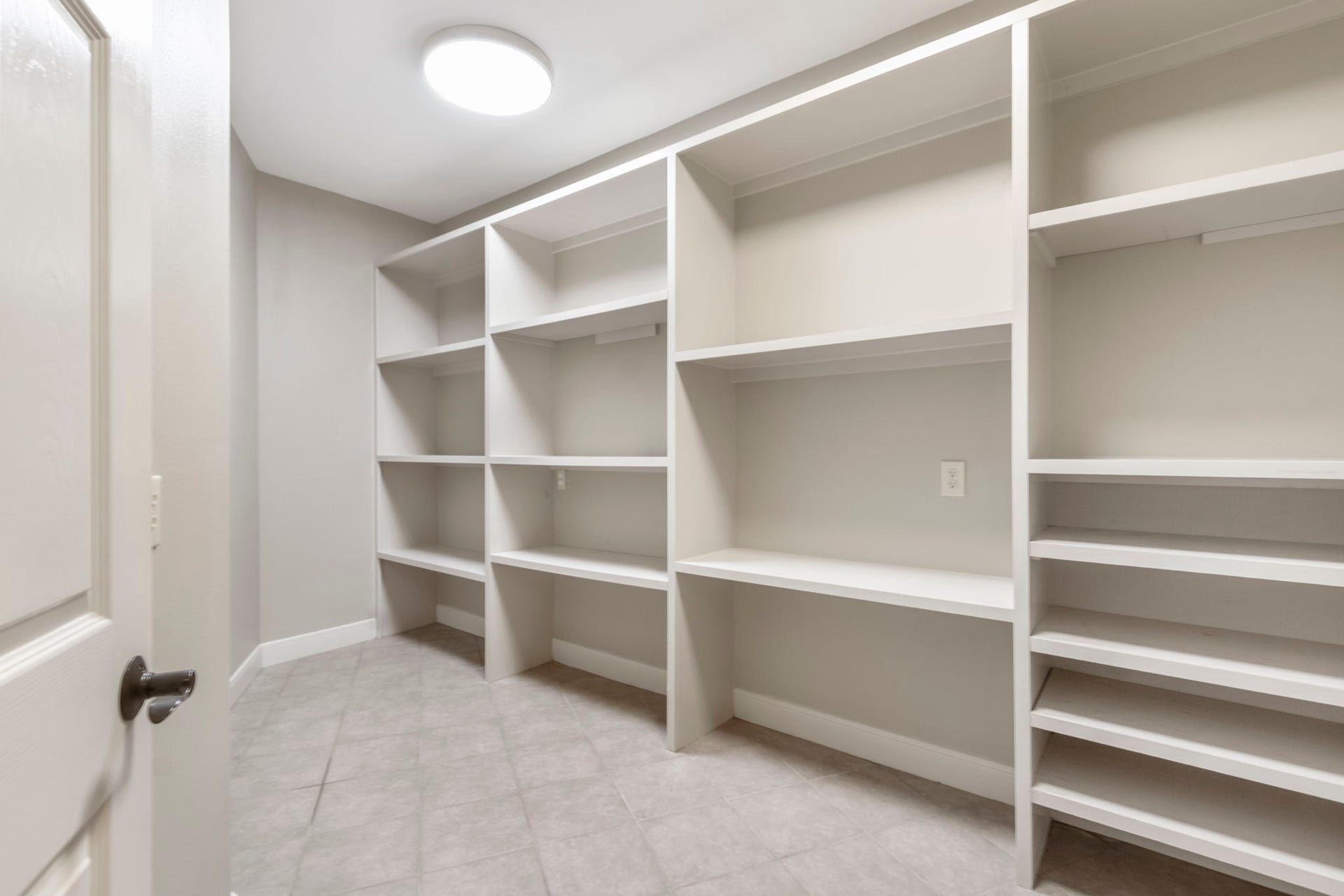 7806 Spirit Hollow Court, Missouri City, TX 77459 Near the entrance to the garage is this extra storage space.