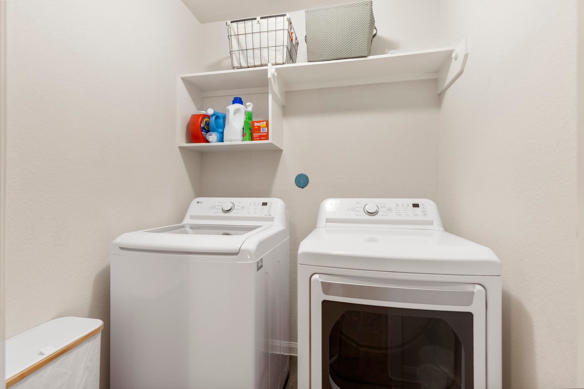 The laundry room provides a dedicated space for everyday household needs.