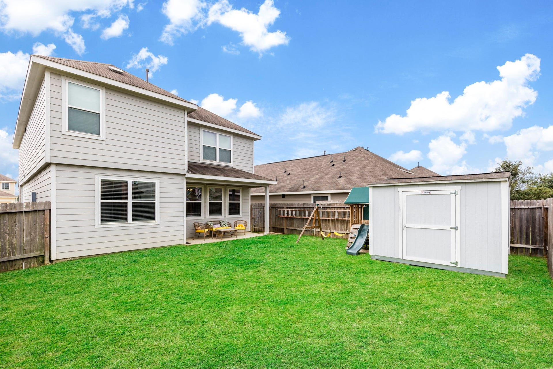 Spacious backyard offers room to relax, entertain, play, or create your ideal outdoor retreat.