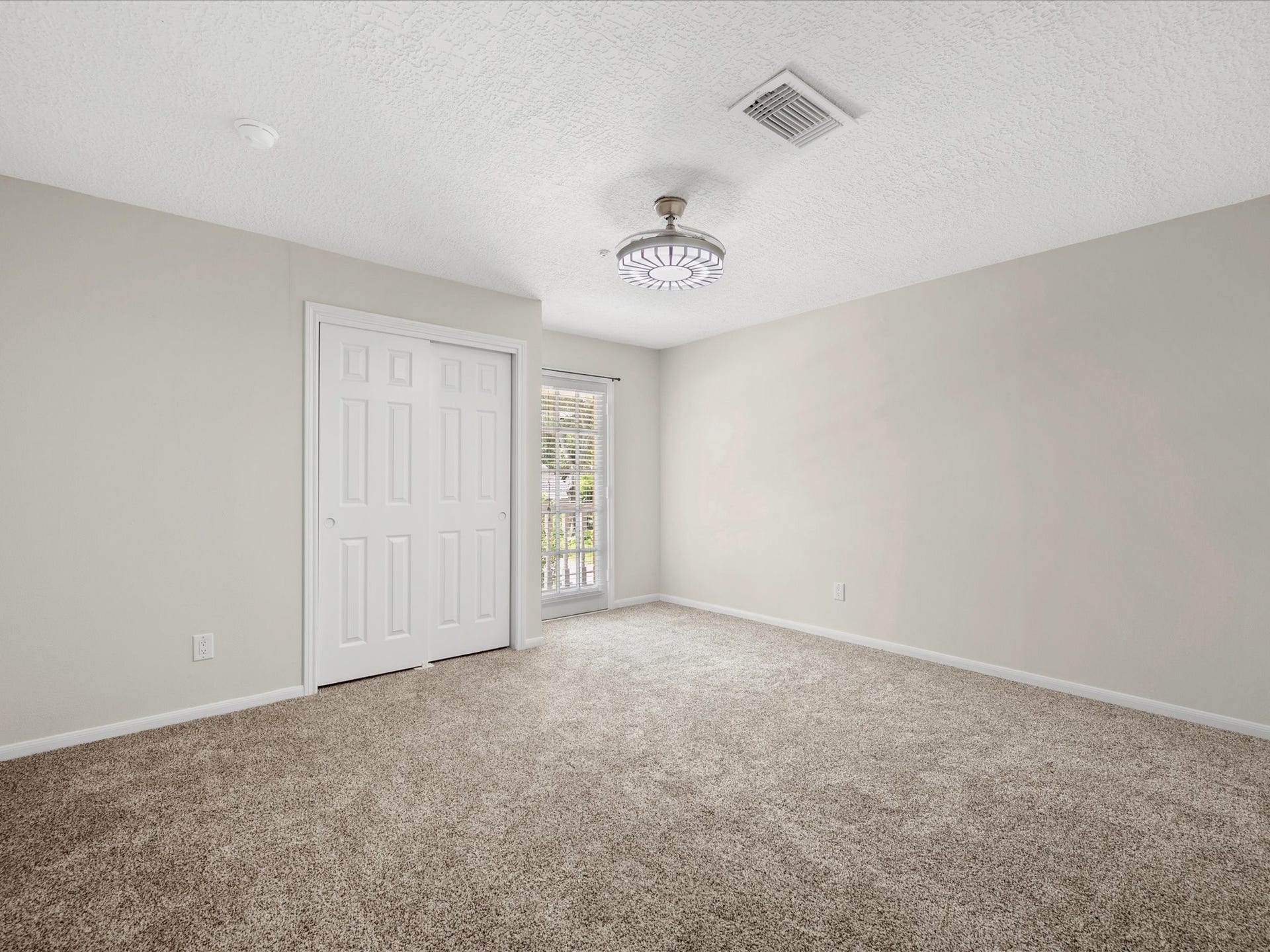 15902 Cumbria Drive, Spring, TX 77379 An upstairs bedroom with a door out to the balcony.
