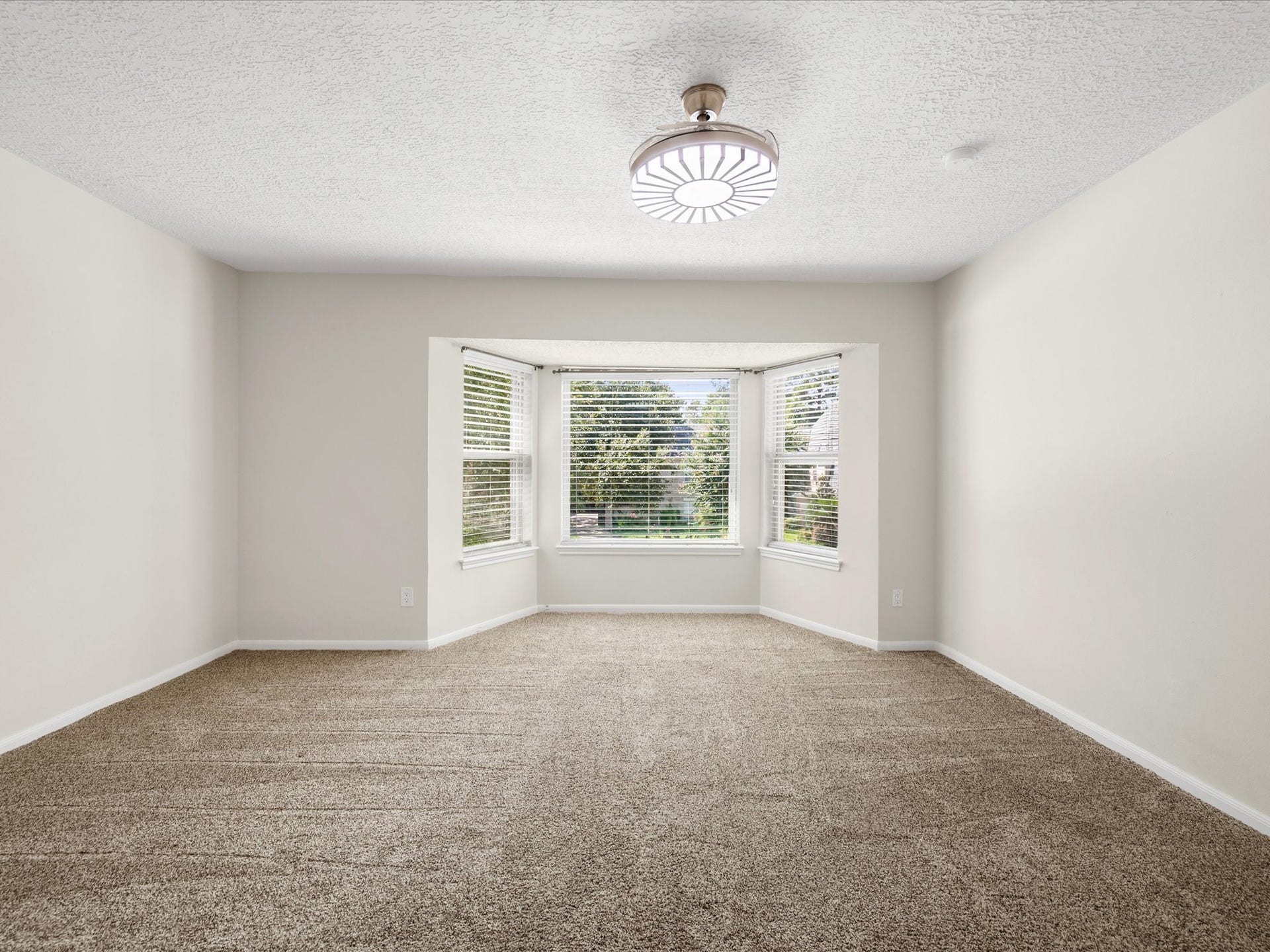 15902 Cumbria Drive, Spring, TX 77379 This upstairs bedroom has a bay window that looks out into the trees.