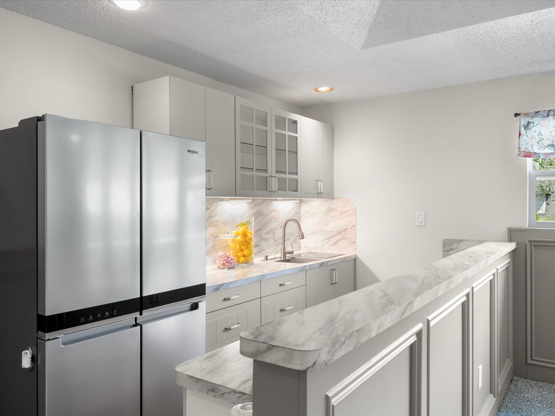 15902 Cumbria Drive, Spring, TX 77379 The upstairs kitchenette, with a full size refrigerator, sink, and cabinets. Guests can make coffee without coming downstairs.