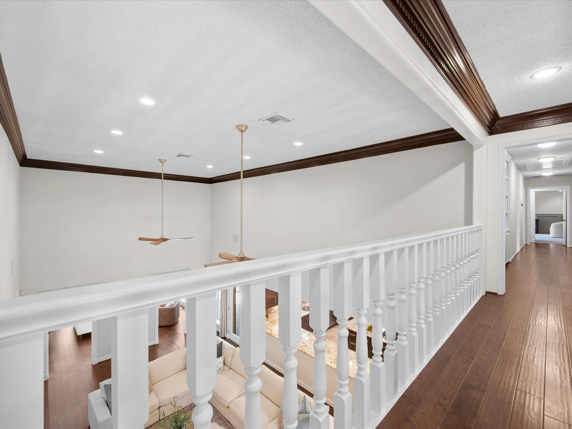 15902 Cumbria Drive, Spring, TX 77379 From the second floor landing, you look down into the living room. The whole house stays connected.