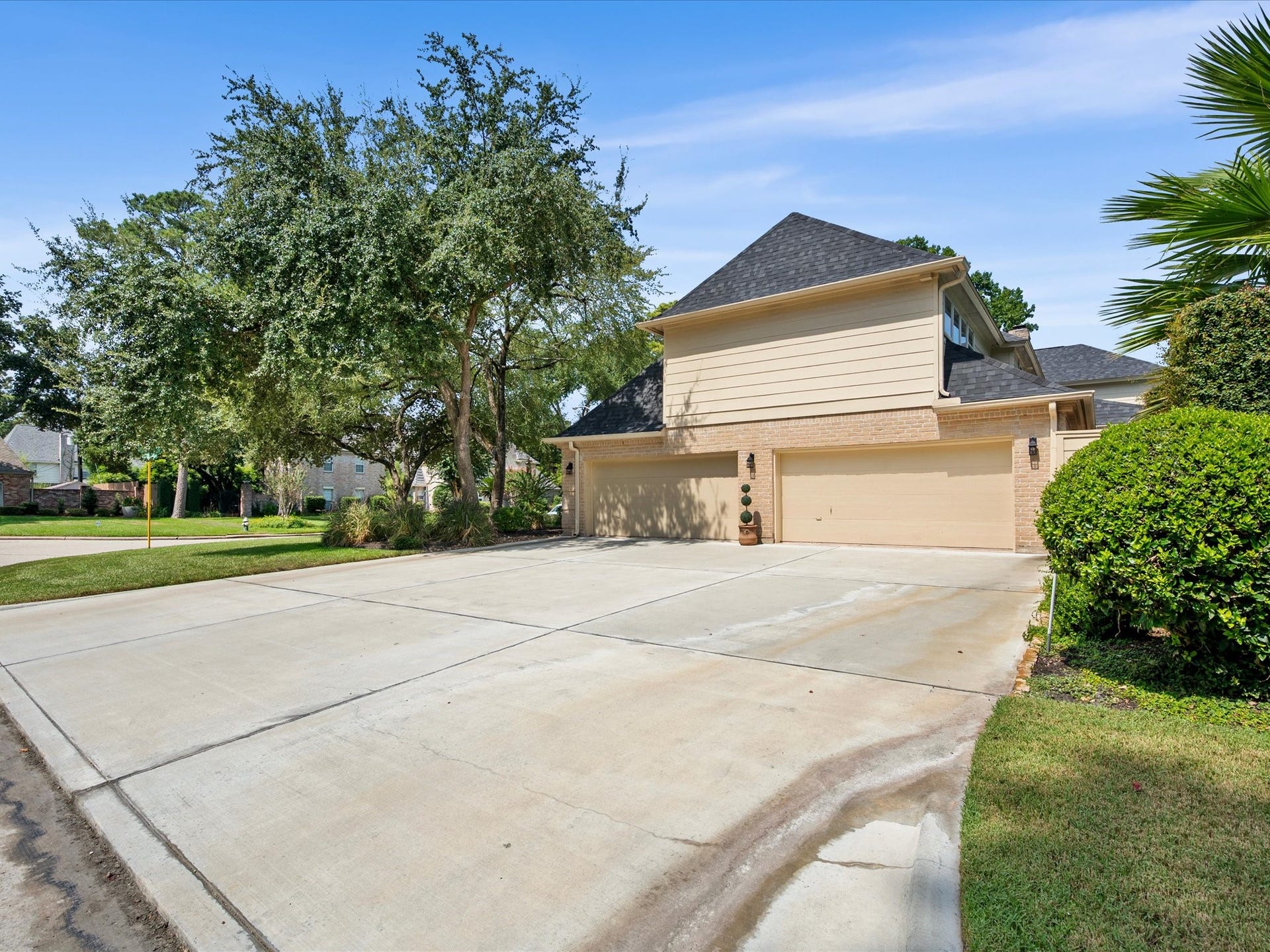 15902 Cumbria Drive, Spring, TX 77379 The four car garage opens straight from the street onto a double wide driveway.