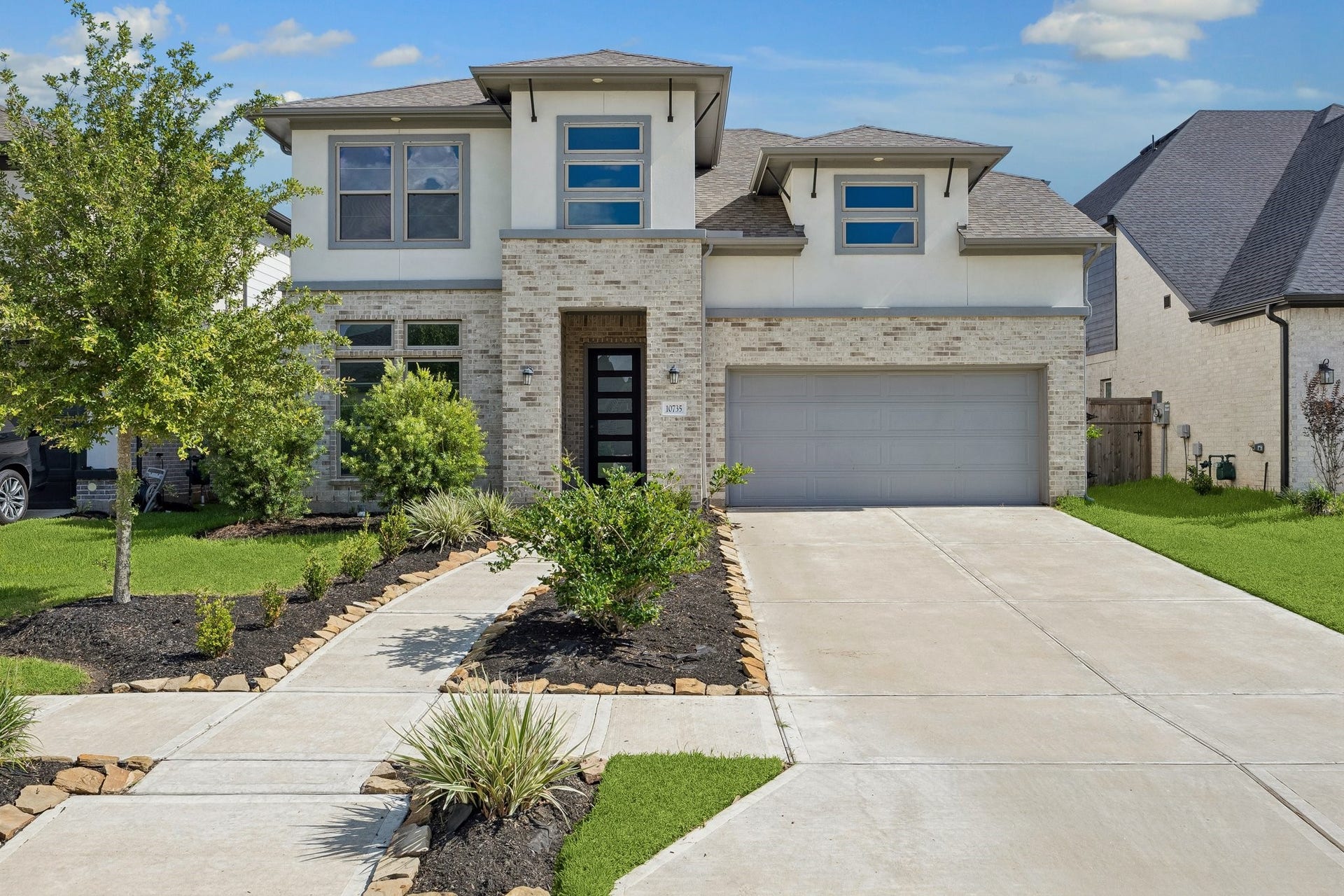 10735 Verdant Hill, Missouri City, TX 77459 Newmark Koblenz floor plan featuring a modern brick and stucco elevation