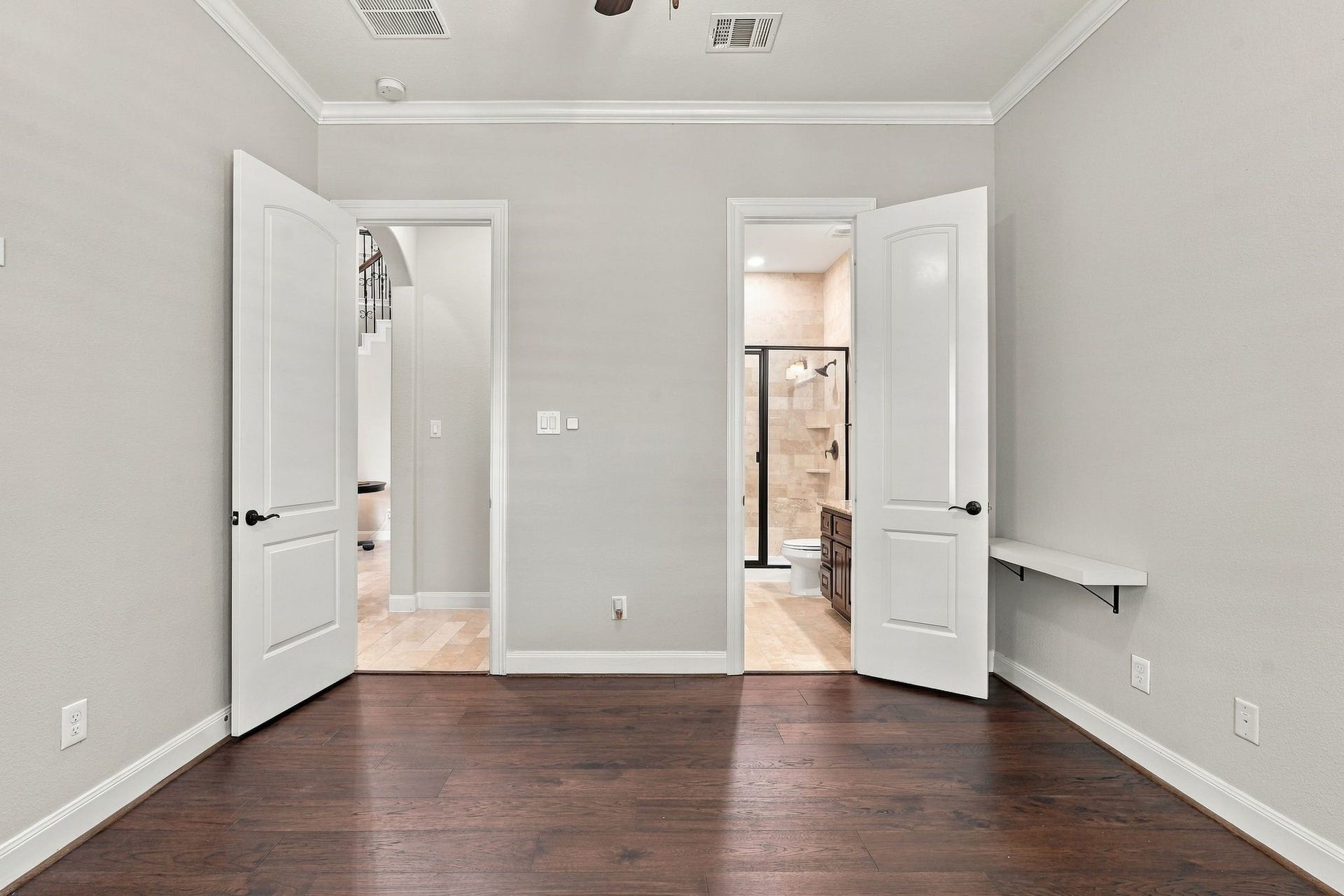 13714 Arcott Bend Drive, Tomball, TX 77377 On the first floor is the second bedroom with hardwood floors and it's own ensuite bathroom.