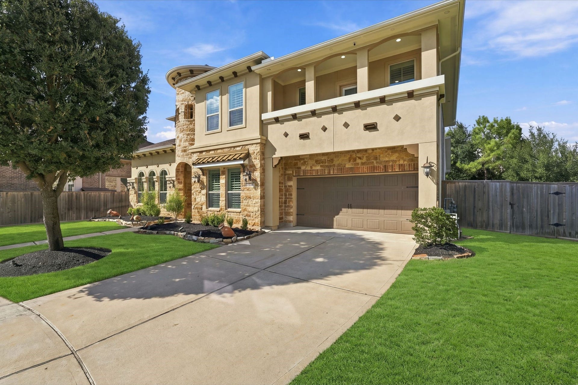 13714 Arcott Bend Drive, Tomball, TX 77377 Beautiful curb appeal! This luxury two-story home in gated Wildwood at Northpointe features elegant stone and stucco architecture, a covered second-story balcony, manicured landscaping, and a 3-car tandem garage. Fresh exterior paint (2023) and a NEW Class 4 impact-resistant roof (2025)!