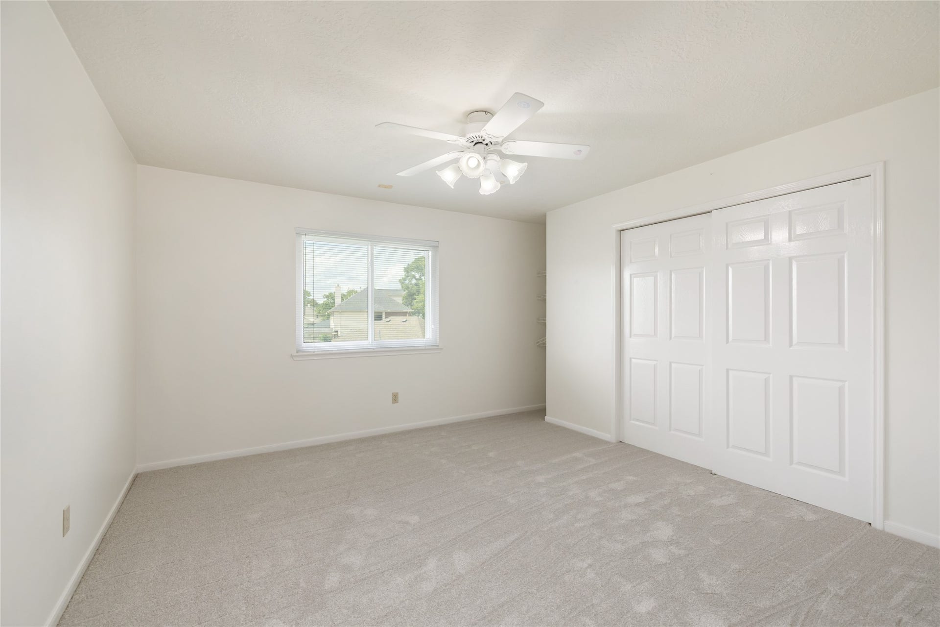 9718 Deverell Drive, Sugar Land, TX 77498 Bedrooms number 3. A wide closet keeps clothes and keepsakes organized.