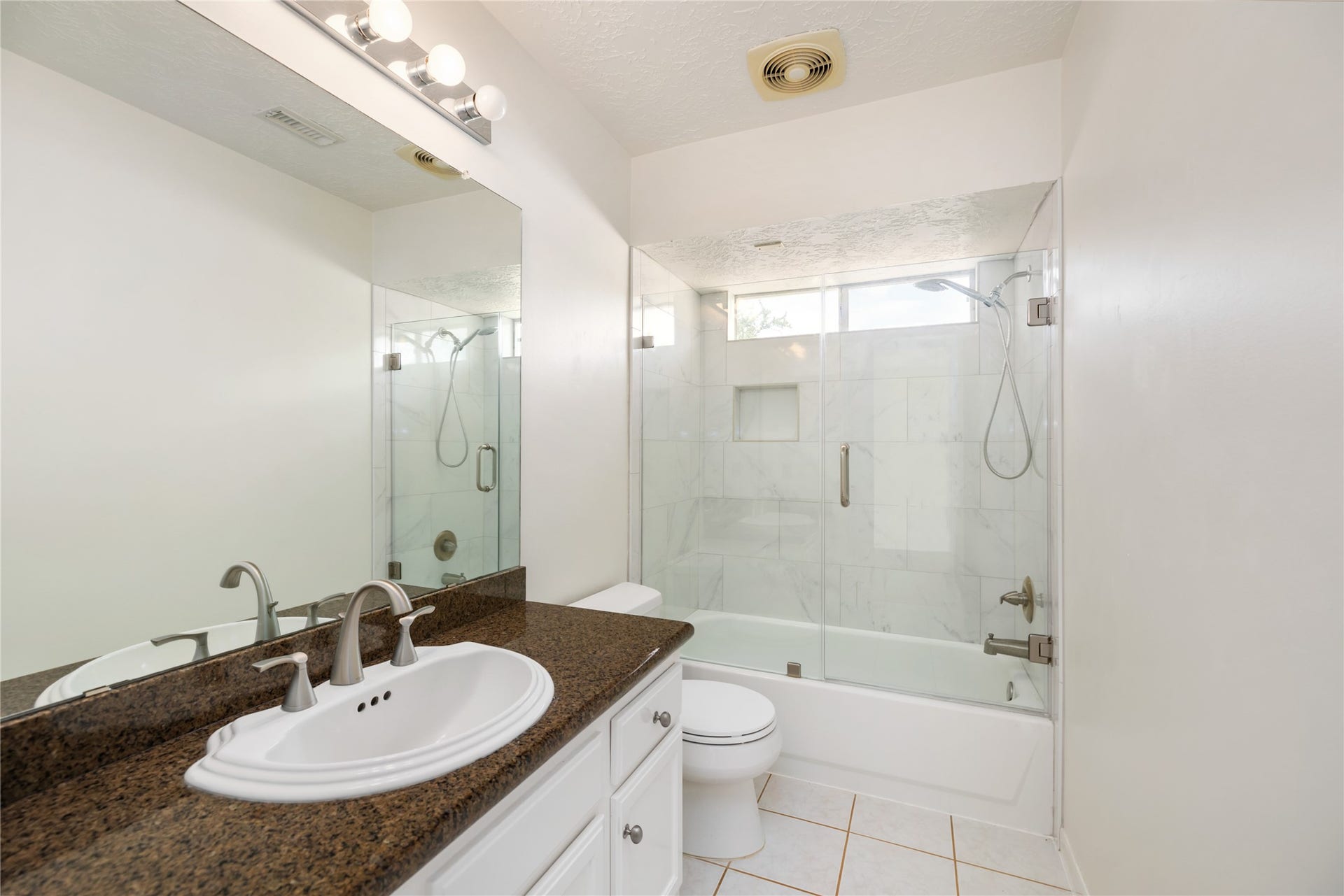 9718 Deverell Drive, Sugar Land, TX 77498 A secondary showers with a tub and shower combo.
