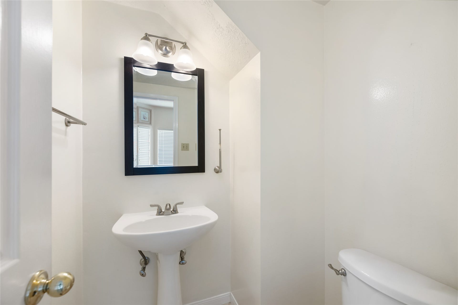 9718 Deverell Drive, Sugar Land, TX 77498 A handy half bath sits downstairs.