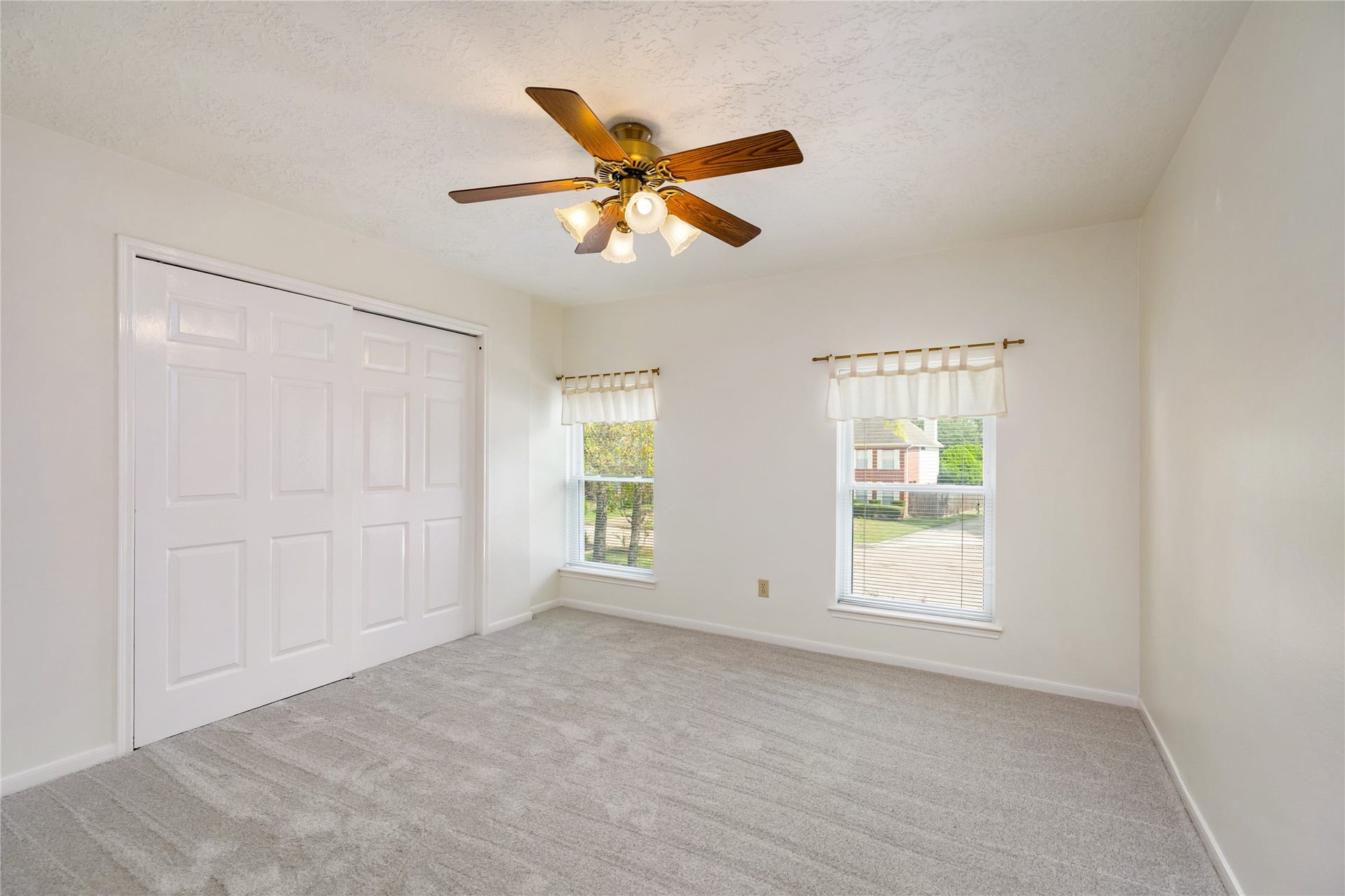 9718 Deverell Drive, Sugar Land, TX 77498 Bedroom number 4. Two windows brighten this cheerful corner.