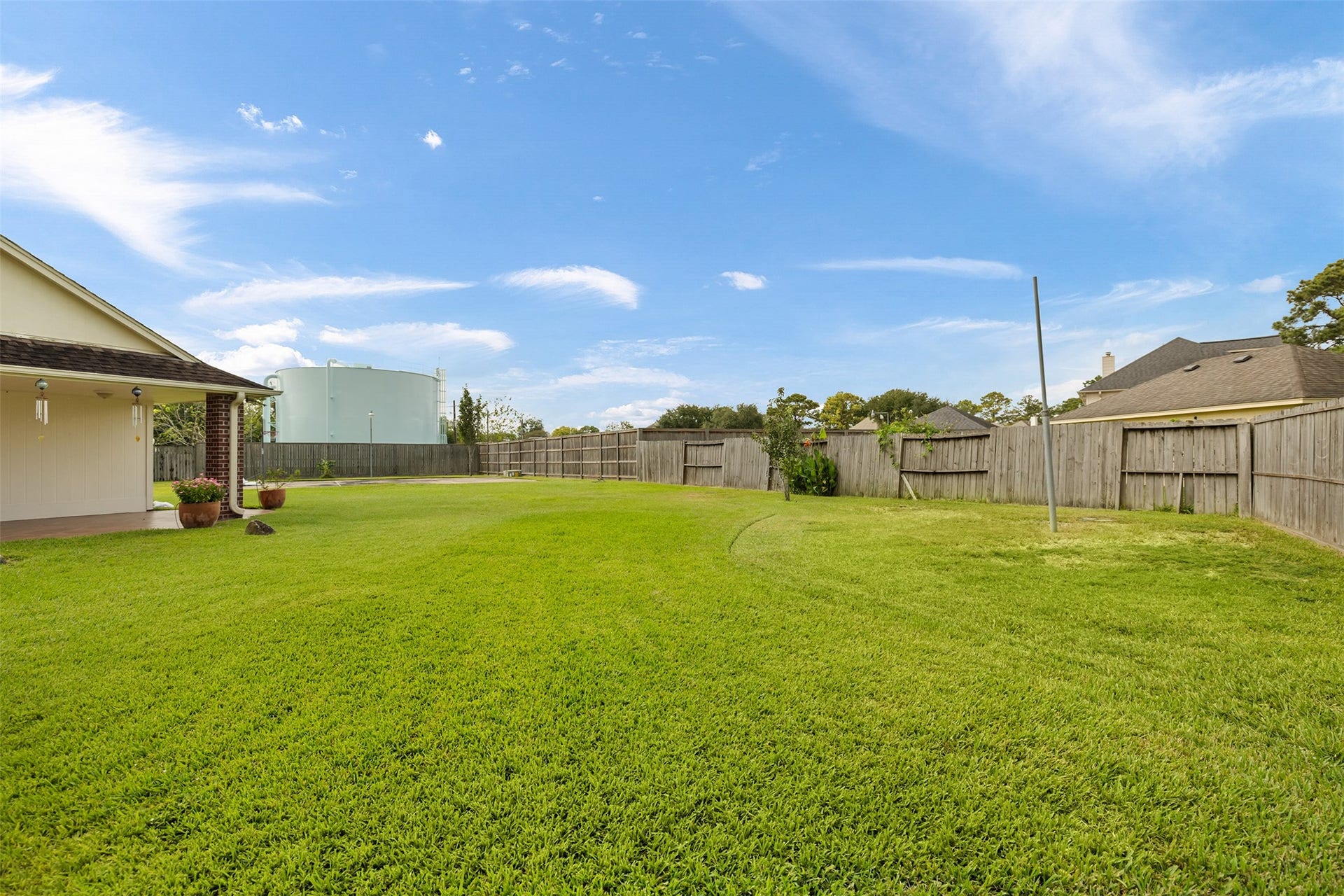 9718 Deverell Drive, Sugar Land, TX 77498 Endless green space on an oversized pie-shaped lot.