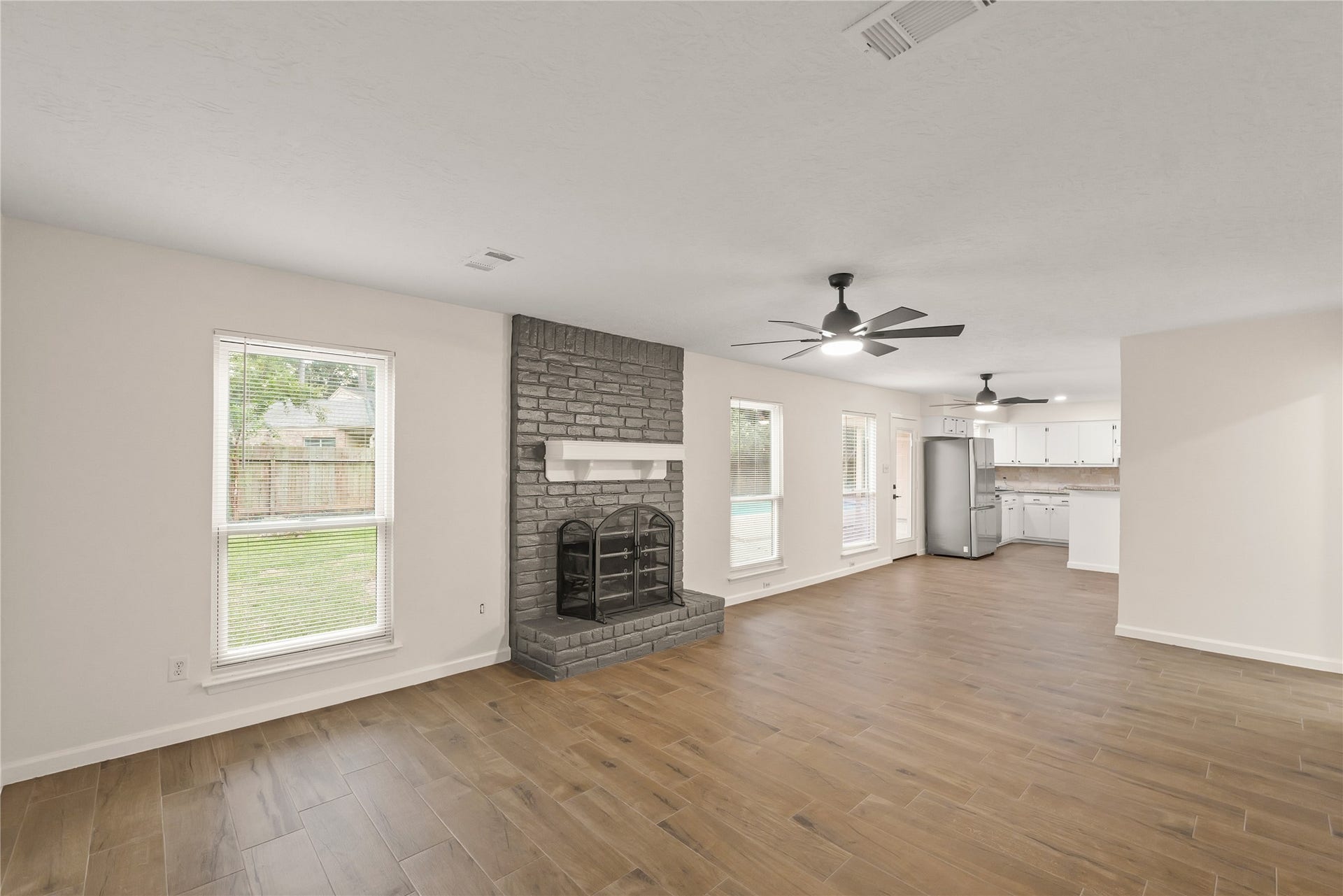 3711 Fern View Drive, Houston, TX 77345 Natural light fills the family and dining room