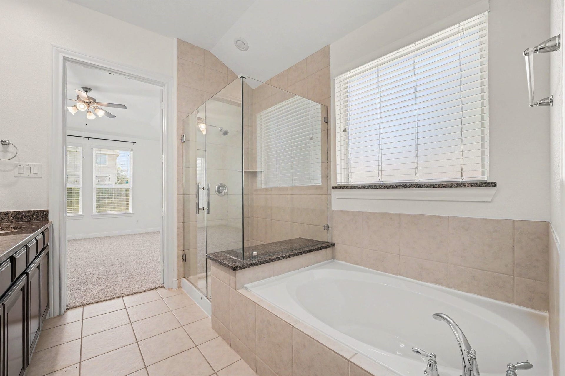Brand new glass shower installed in the primary bathroom