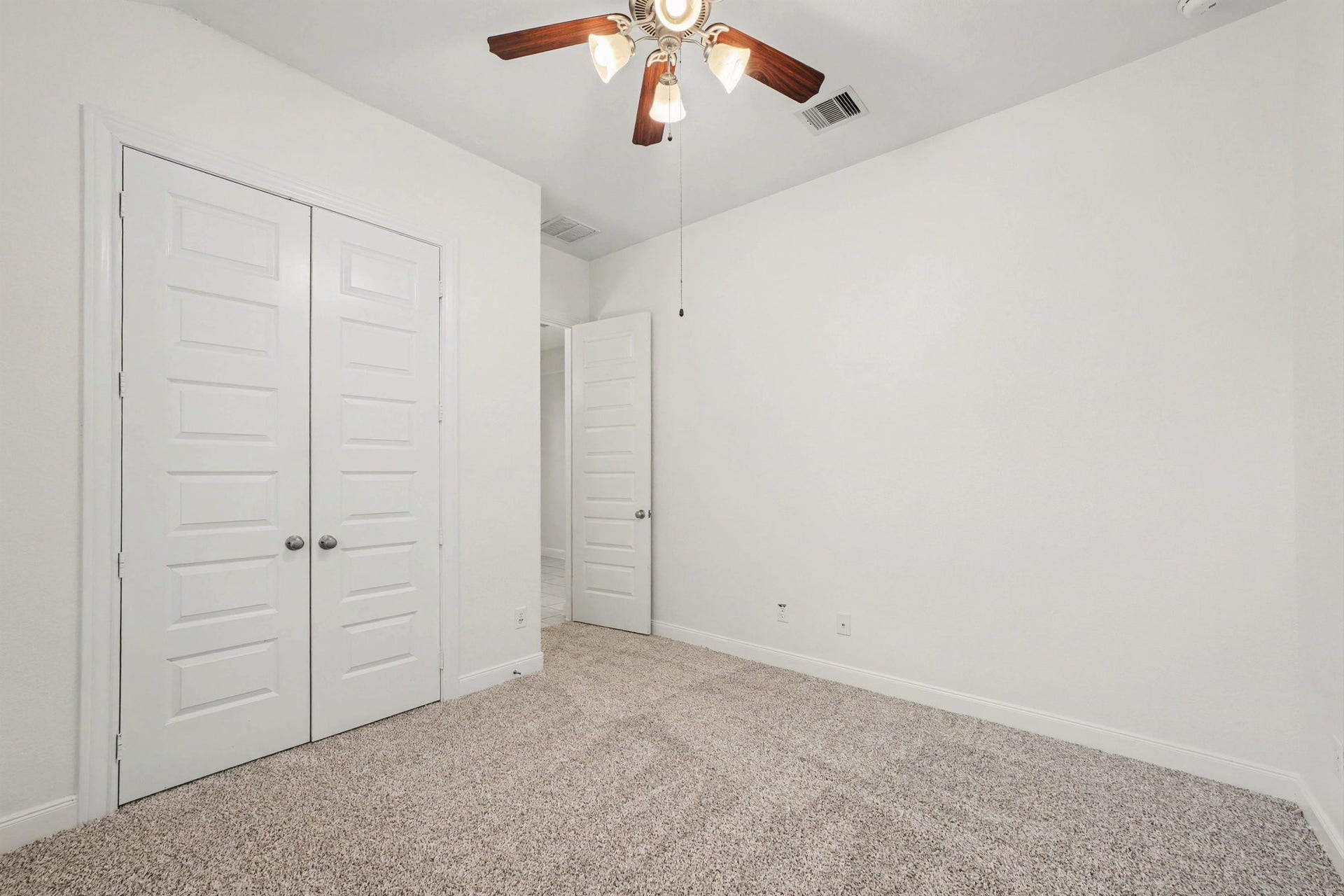 Guest Bedroom 1 with newly installed carpet