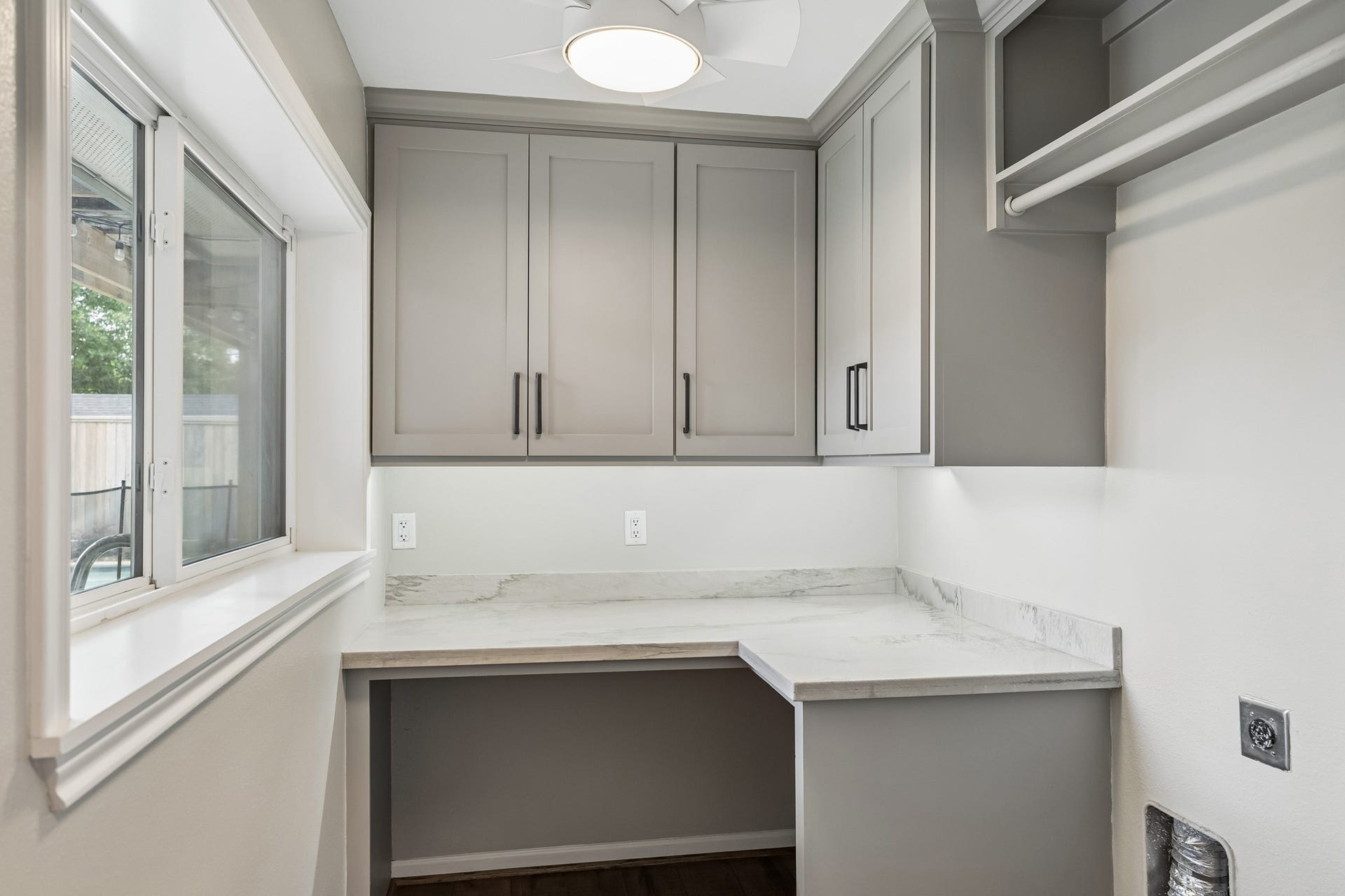 1022 Martin Street, Houston, TX 77018 Gorgeous laundry with built in cabinets, desk area, and sunny window to the back yard.