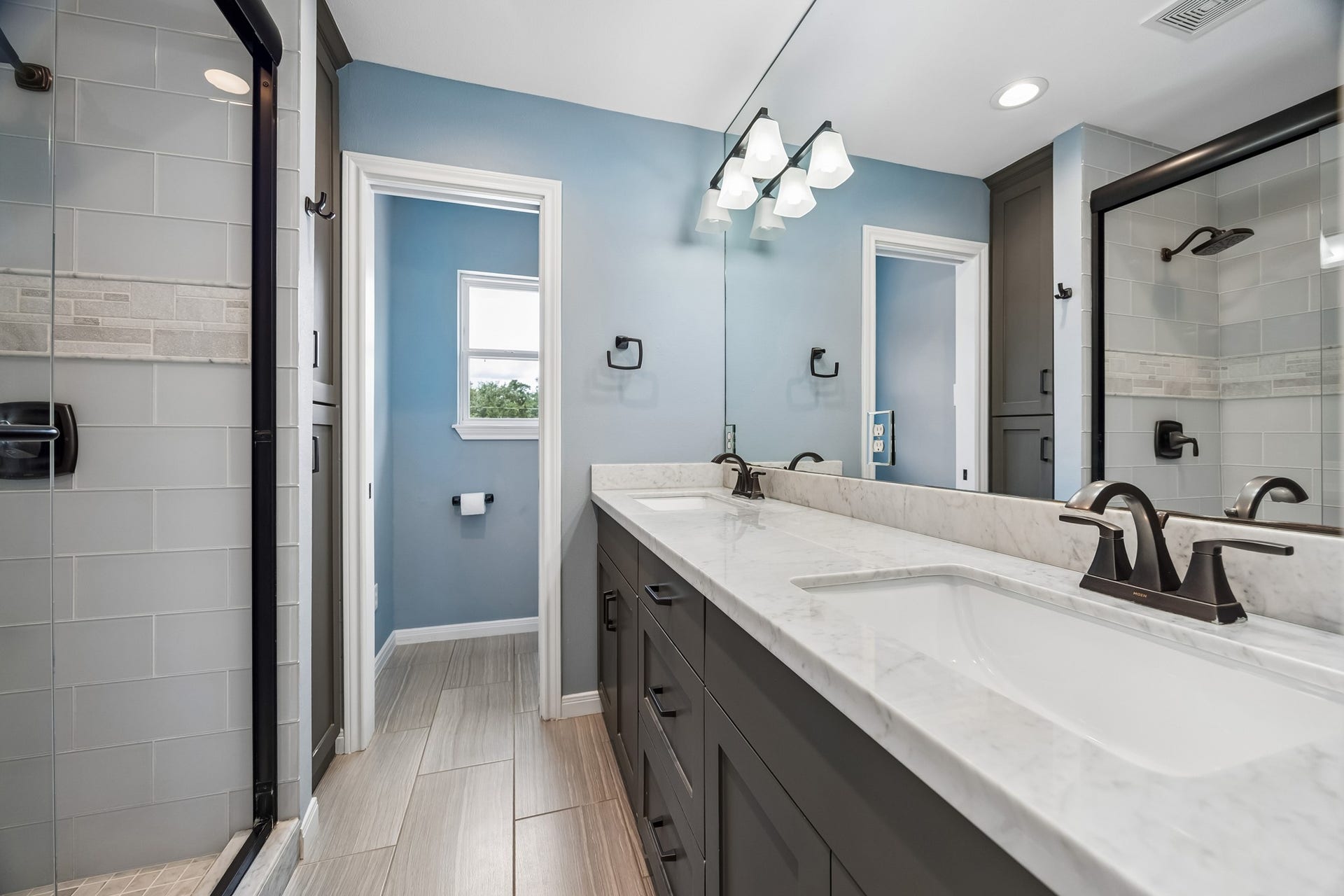1022 Martin Street, Houston, TX 77018 Hall bath has private separated toilet area and custom shower.