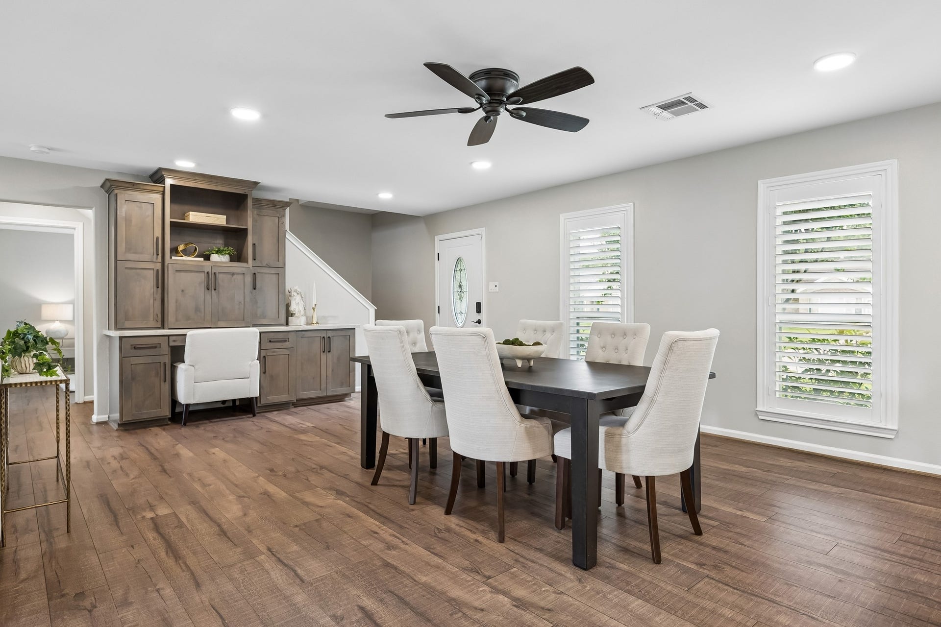 1022 Martin Street, Houston, TX 77018 The entry flows seamlessly into dining and living areas and features a custom built-in desk cabinet with stone counter.