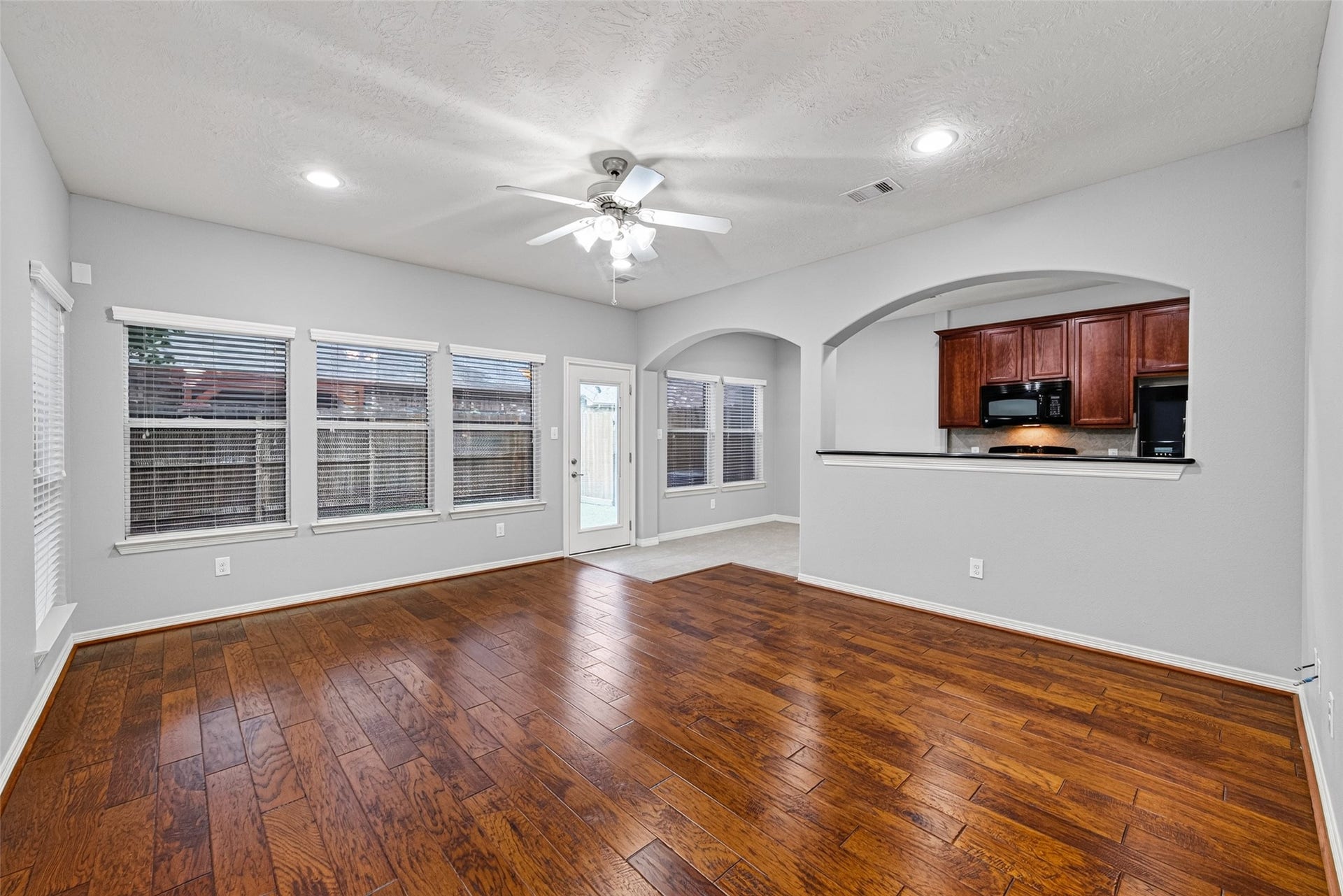 8910 Minola Oaks Drive, Houston, TX 77064 Living Room with views to a grassy back yard.