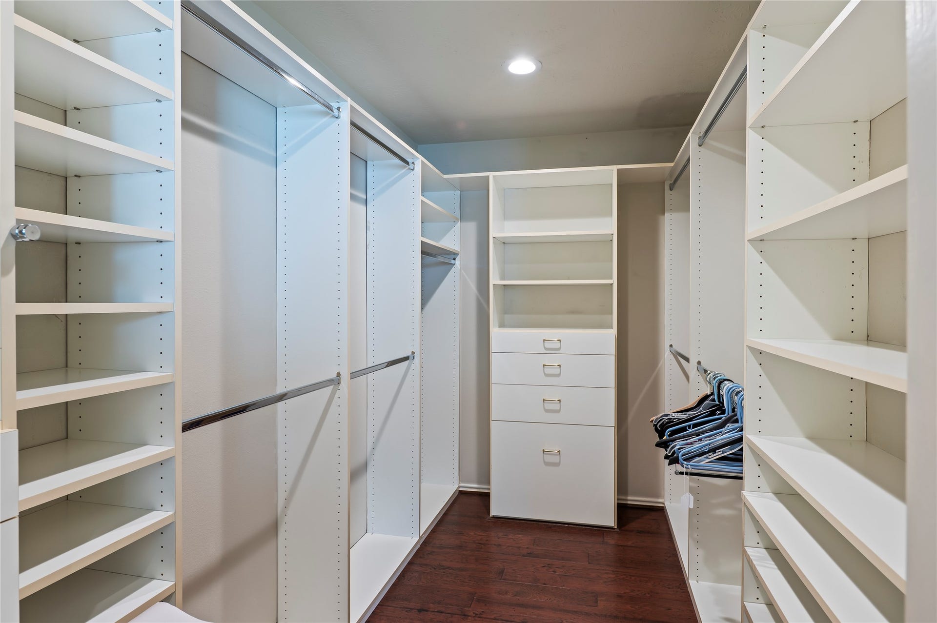 2009 Stapleton Drive, Friendswood, TX 77546 Walk in closet with wood flooring and wall to wall built ins.