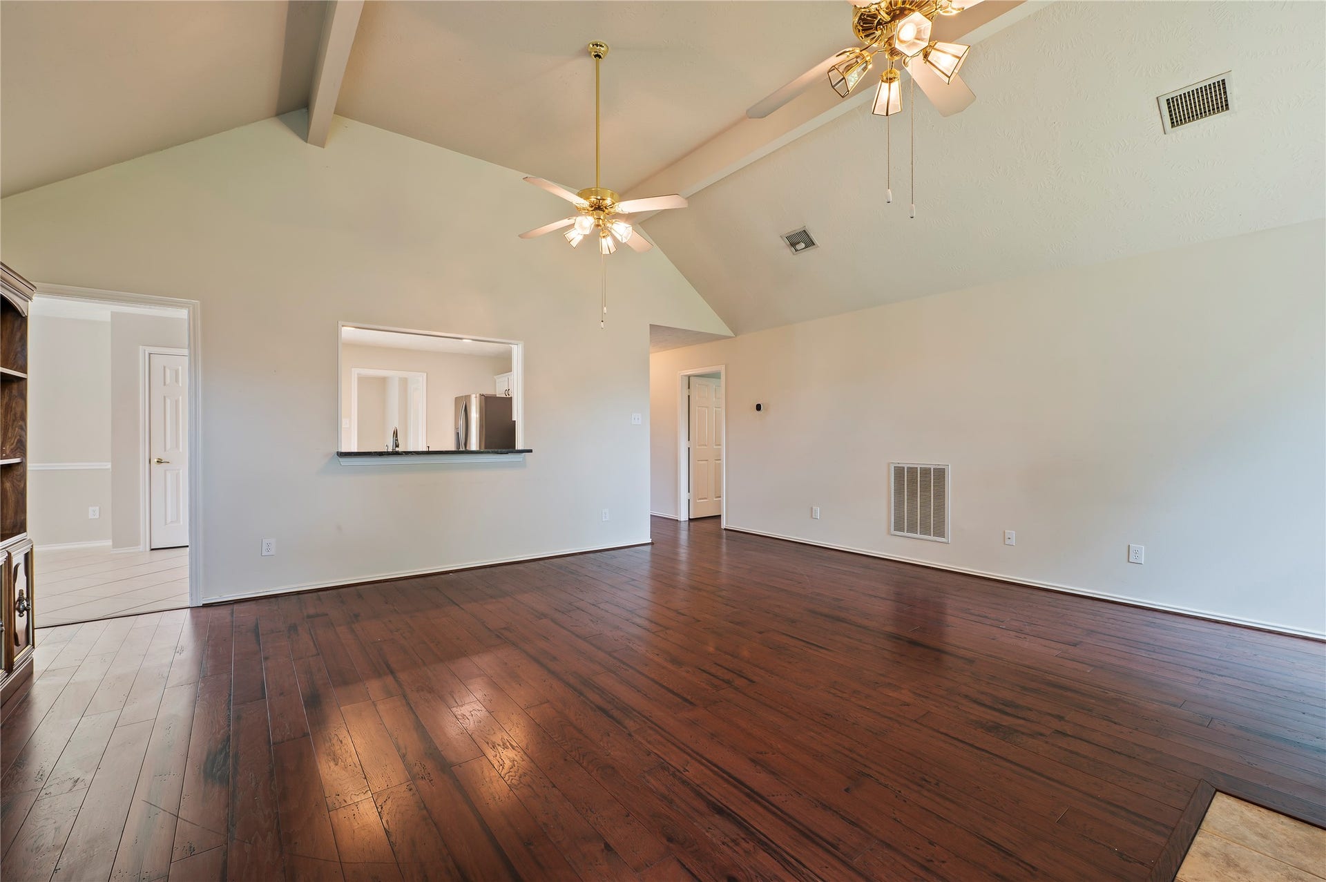 2009 Stapleton Drive, Friendswood, TX 77546 Another view of the large living room space with wood flooring throughout.