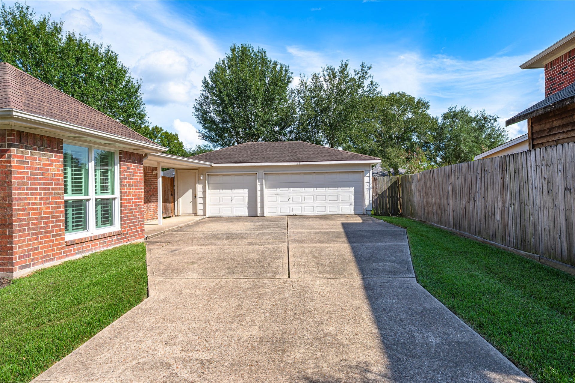2009 Stapleton Drive, Friendswood, TX 77546 Widened driveway leads back to the 3 car detached garage.
