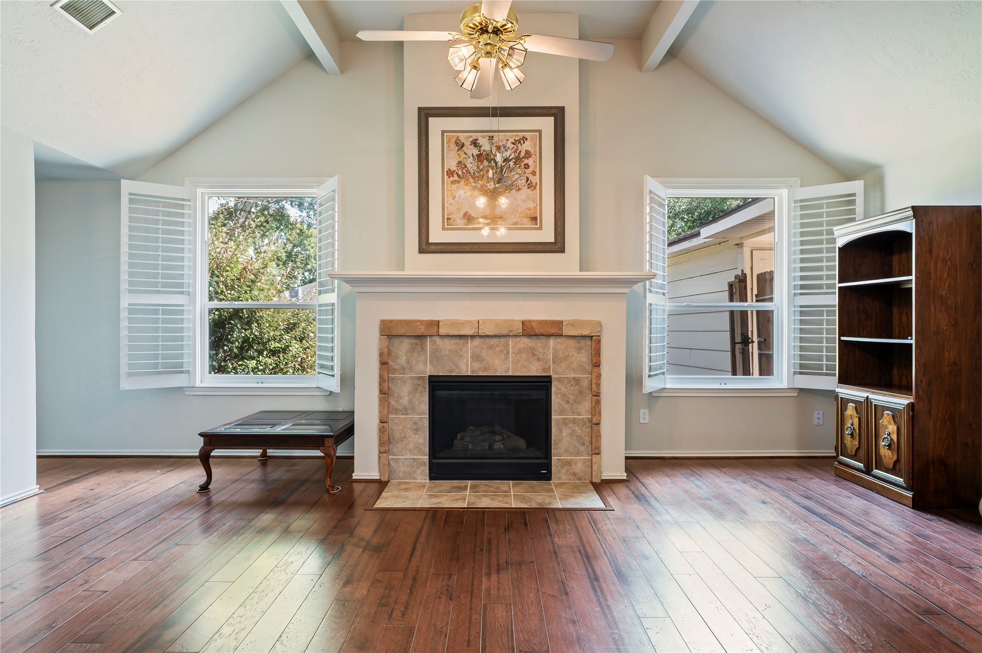 2009 Stapleton Drive, Friendswood, TX 77546 Tiled fireplace with decorators mantle in the living room.