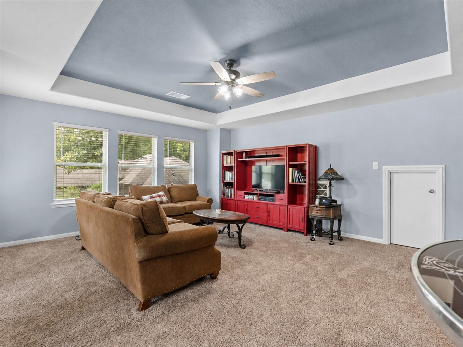 28619 Riverside Crest Lane, Huffman, TX 77336 Natural light fills the spacious upstairs game room, creating an inviting place to relax and gather.