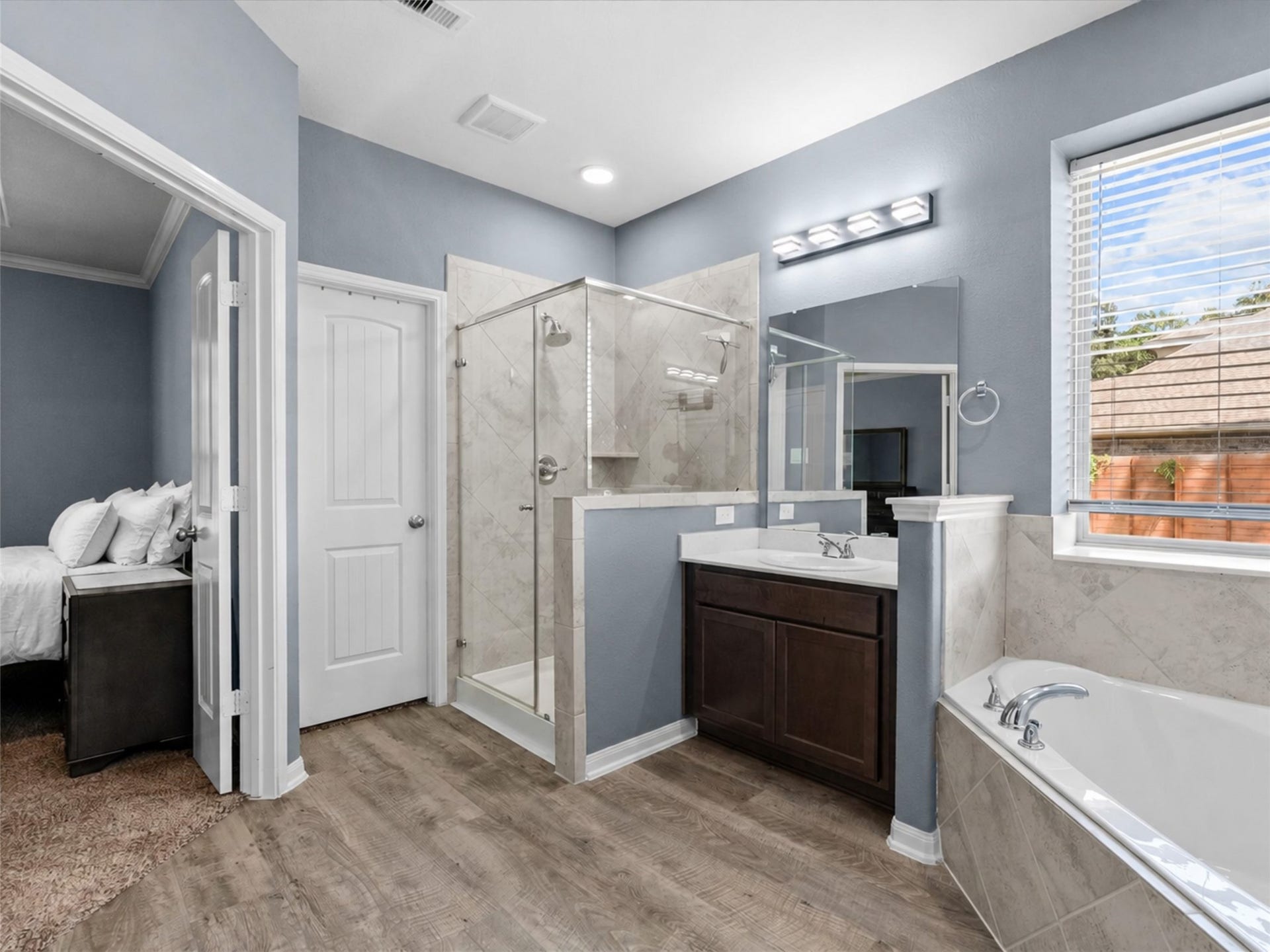 28619 Riverside Crest Lane, Huffman, TX 77336 The primary bath offers a separate shower, soaking tub and plenty of space to get ready with ease.