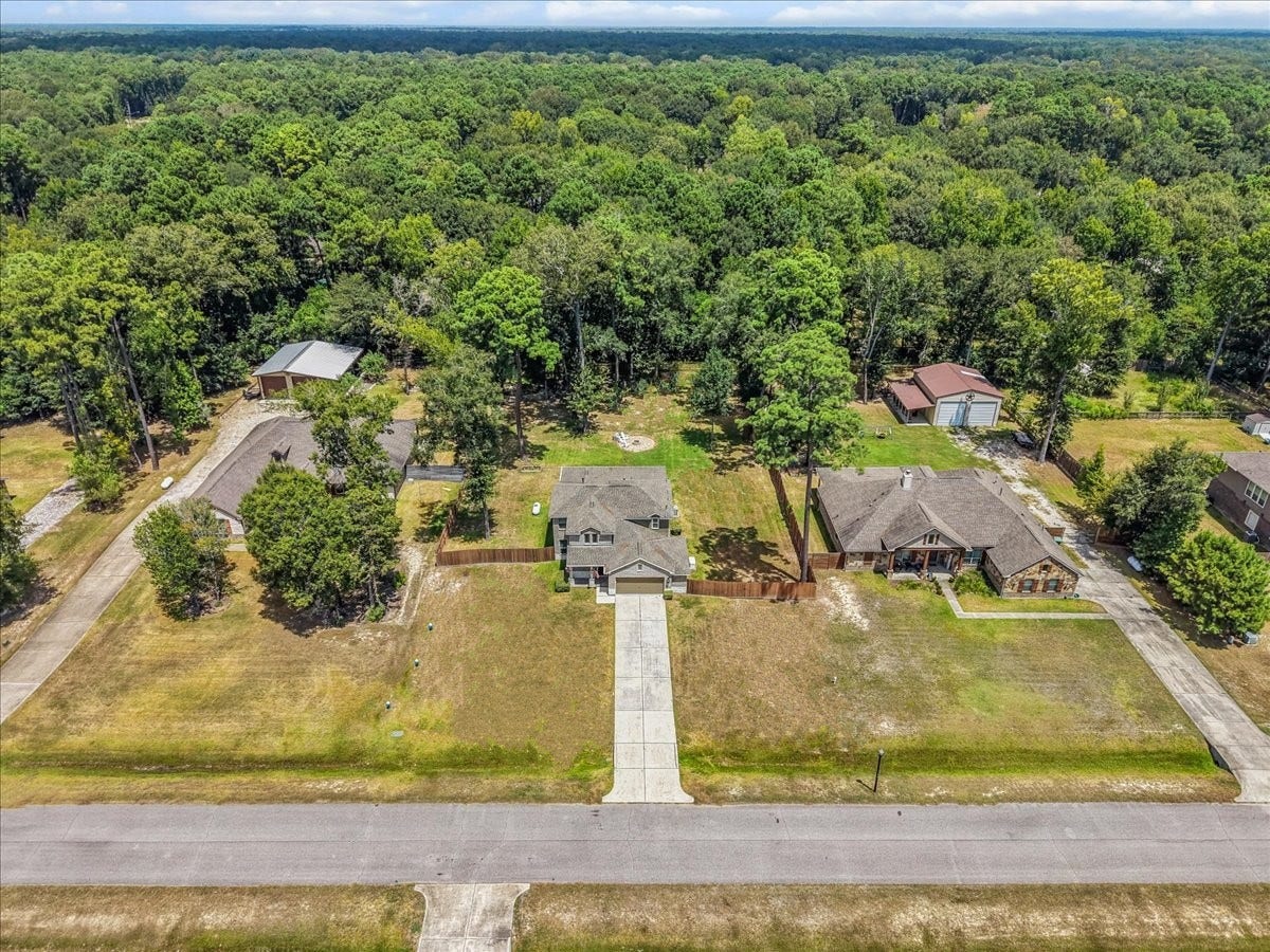 28619 Riverside Crest Lane, Huffman, TX 77336 Aerial view showcases the home's generous lot, spacious surroundings and beautiful wooded setting.