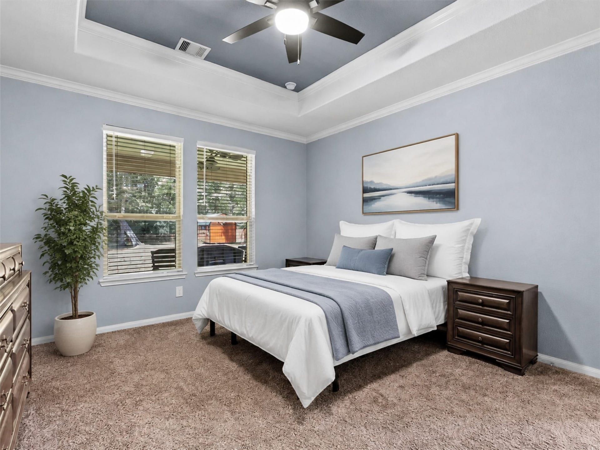28619 Riverside Crest Lane, Huffman, TX 77336 Retreat to the spacious first-floor primary suite featuring a tray ceiling, fresh paint and peaceful natural light.