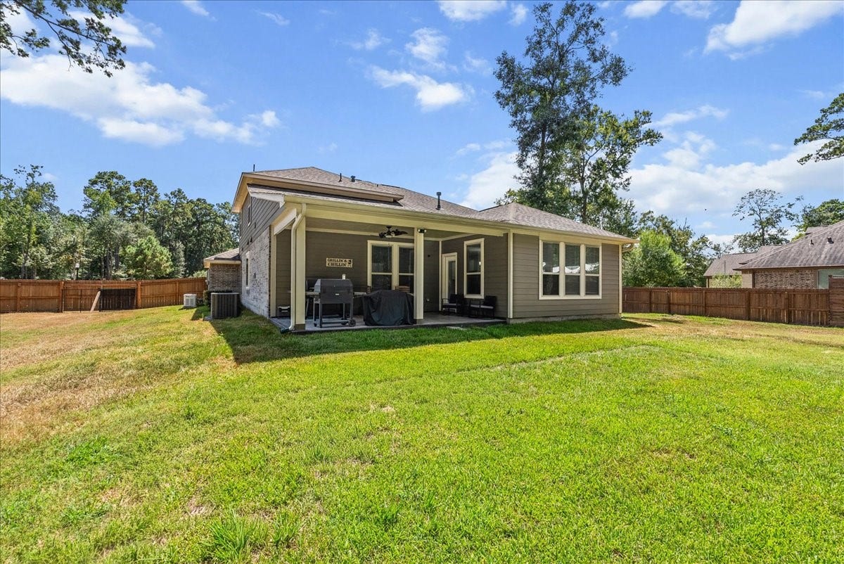 28619 Riverside Crest Lane, Huffman, TX 77336 Step outside to a huge cleared and fenced backyard with room to play, entertain, garden or simply enjoy the space.