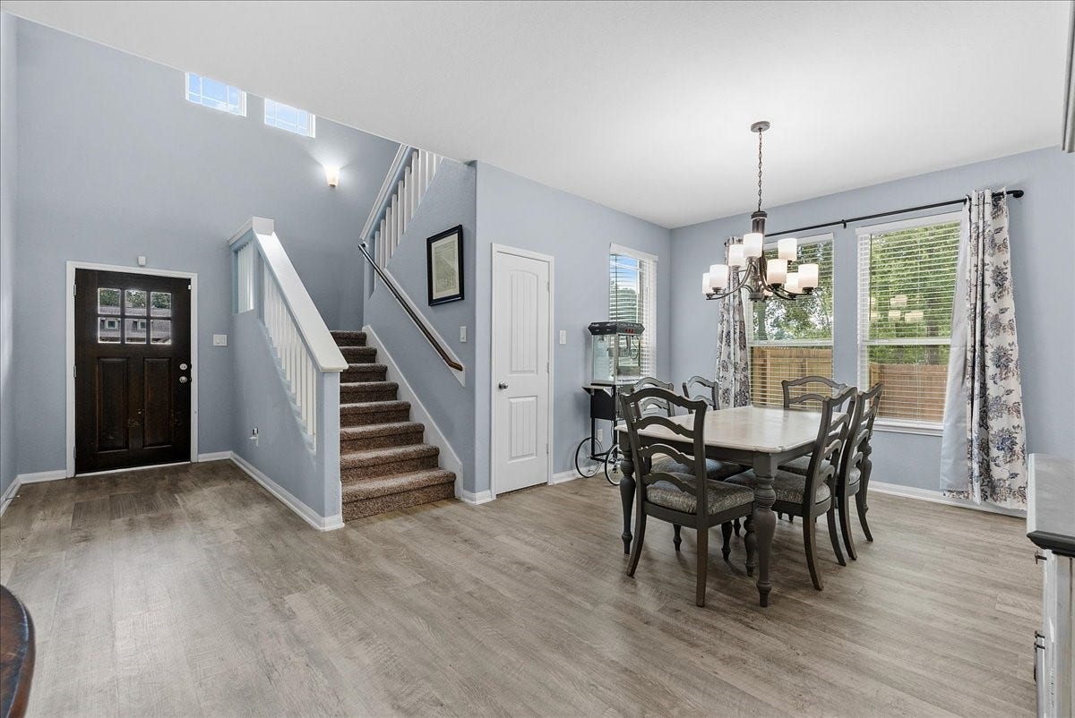 28619 Riverside Crest Lane, Huffman, TX 77336 A welcoming entry opens to a bright dining area and an easy-flowing floor plan that immediately feels like home.