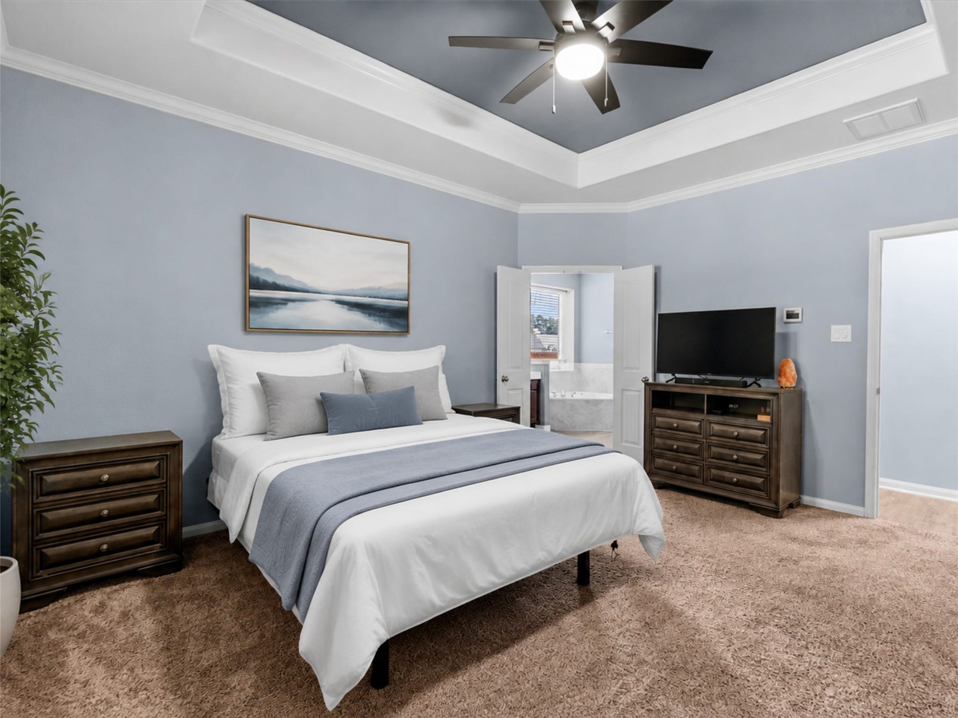 28619 Riverside Crest Lane, Huffman, TX 77336 The primary suite offers a relaxing retreat with plenty of room to unwind at the end of the day.
