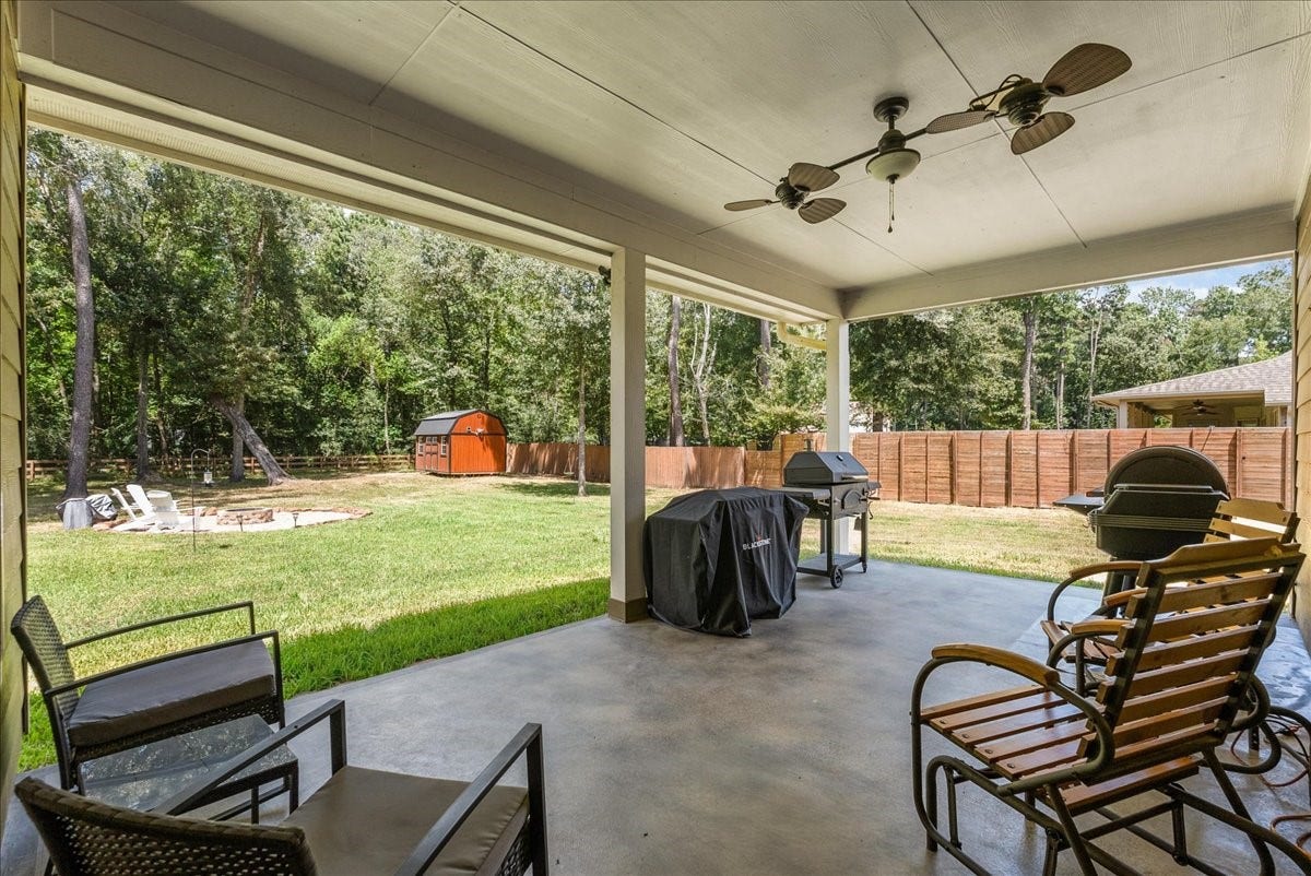 28619 Riverside Crest Lane, Huffman, TX 77336 The covered back patio creates the perfect spot for morning coffee, weekend cookouts or simply enjoying the view.