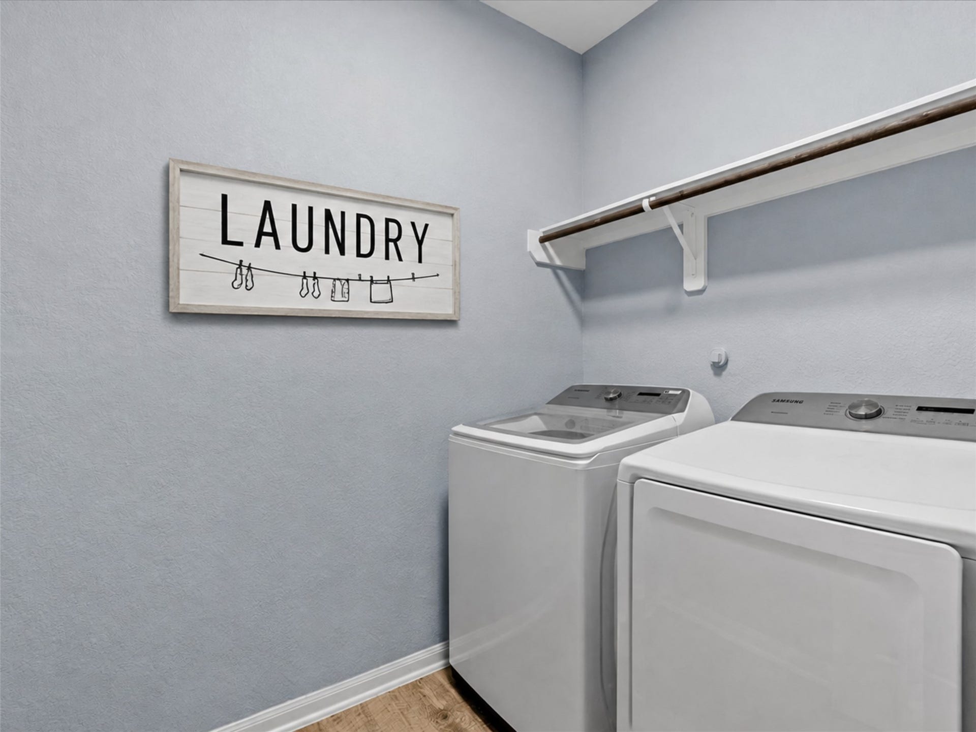 28619 Riverside Crest Lane, Huffman, TX 77336 Dedicated laundry room provides convenient everyday functionality and extra storage space.