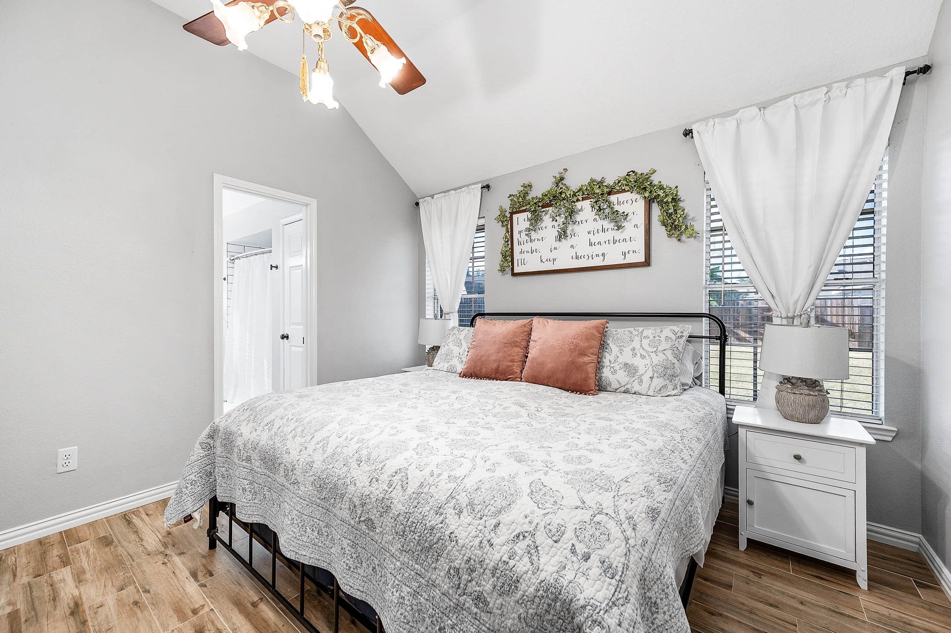 Primary bedroom with plenty of natual light