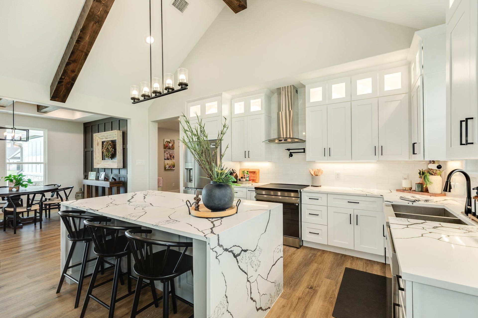 608 Angus Trail, Angleton, TX 77515 Vaulted ceiling with wood beams provide a perfect accent to the kitchen. Plenty of cabinets, and a pot filler make this kitchen a dream