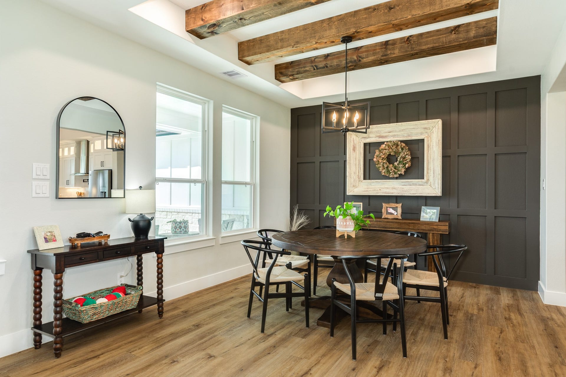 608 Angus Trail, Angleton, TX 77515 Located to the left of the entry is the large dining area with gorgeous wood beams and a beautiful accent wall
