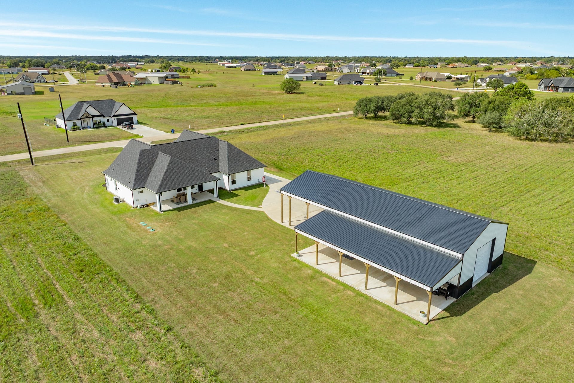 608 Angus Trail, Angleton, TX 77515 30x50 Workshop with electricity and 25' expanded awning/patio cover